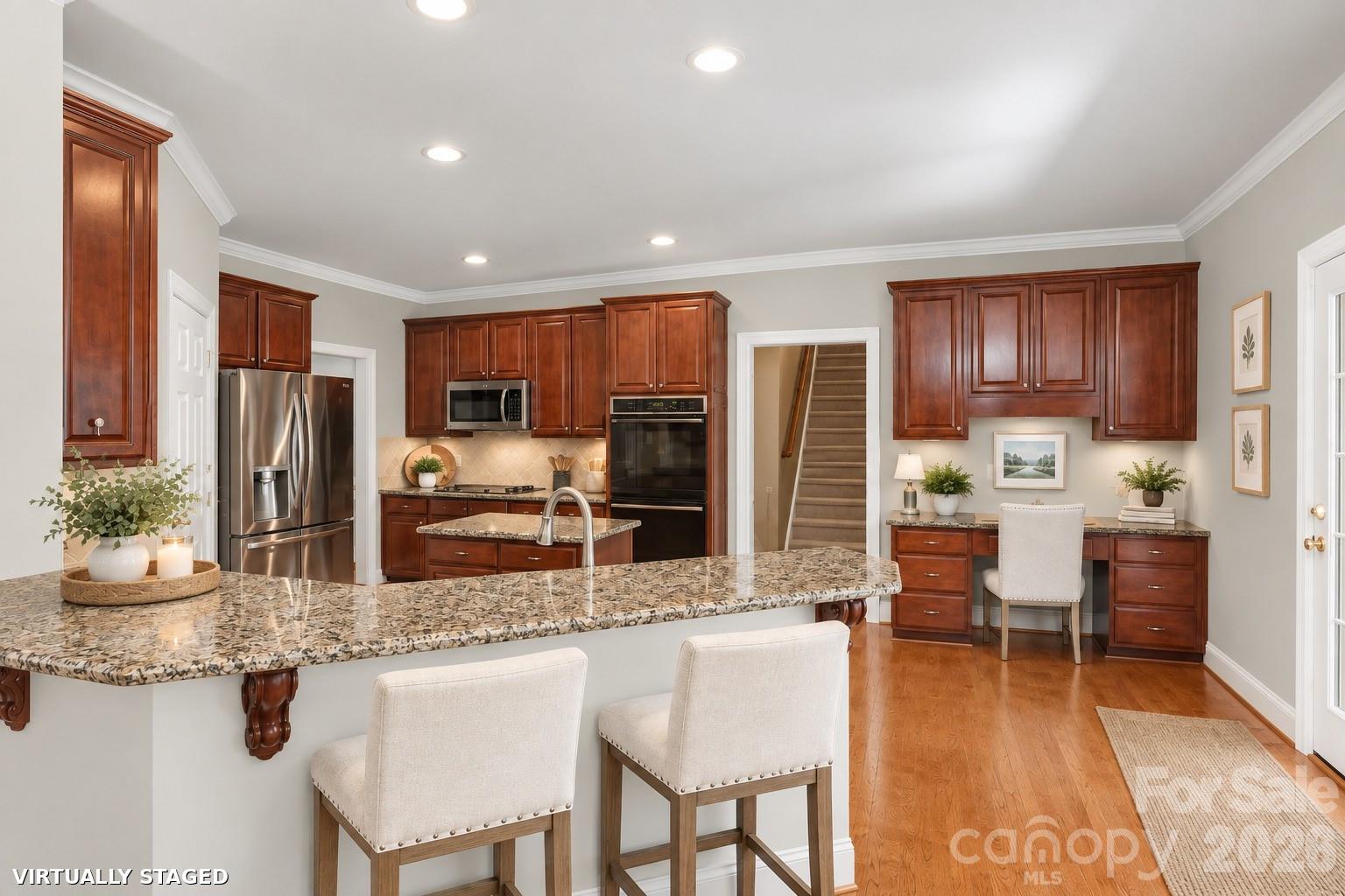 Brand new Benjamin Moore Calm throughout most of downstairs. Chairs and greenery virtually staged. - 2401 Flagstick Drive, Matthews
