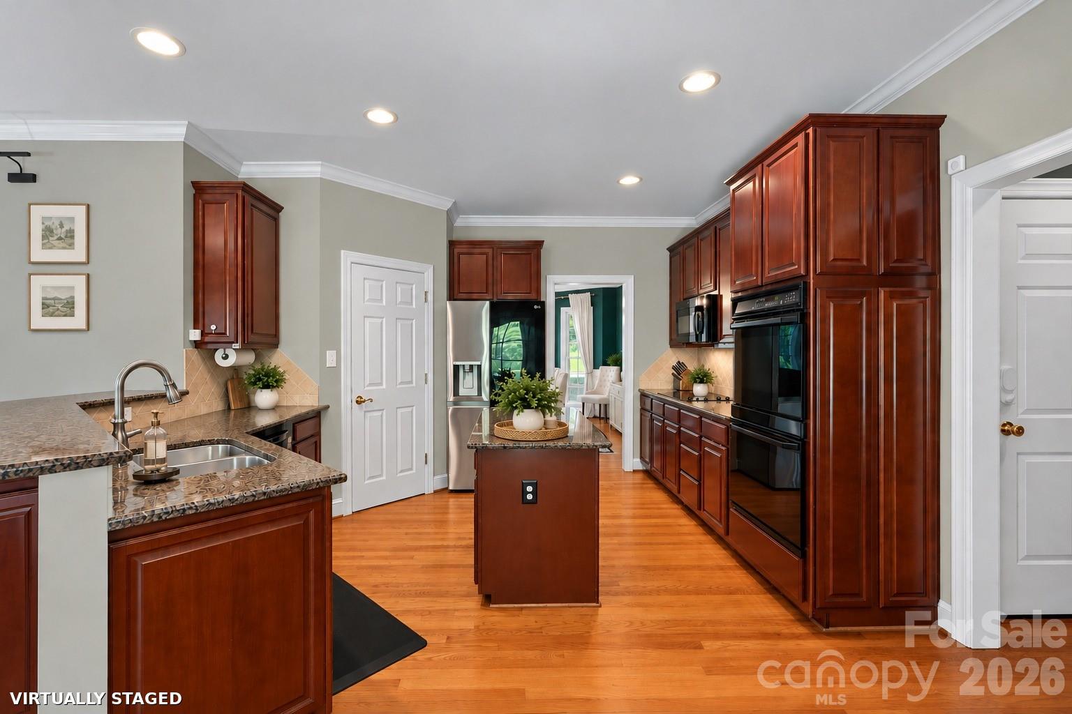 Brand new Benjamin Moore Calm throughout most of downstairs. Greenery virtually staged. - 2401 Flagstick Drive, Matthews