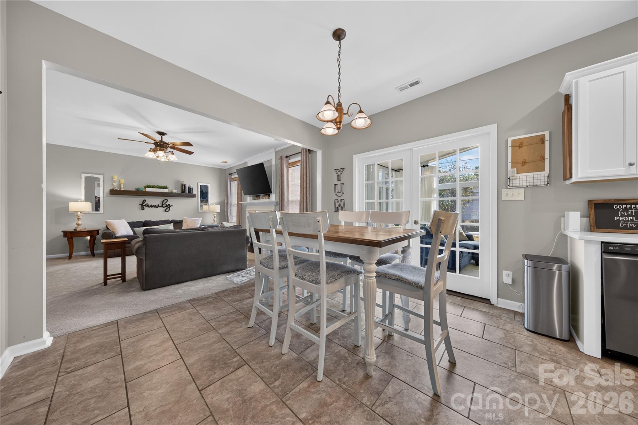 Eat-in Kitchen, French doors lead to sunroomand look into adjoining great room - 5725 Lindley Crescent Drive, Indian Trail