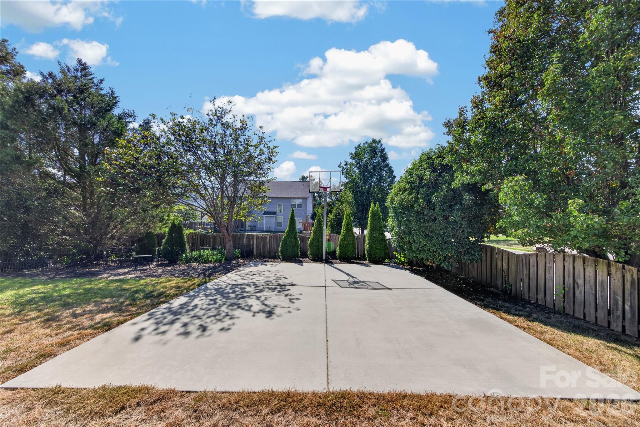 Concrete basketball pad with installed hoop - 5725 Lindley Crescent Drive, Indian Trail