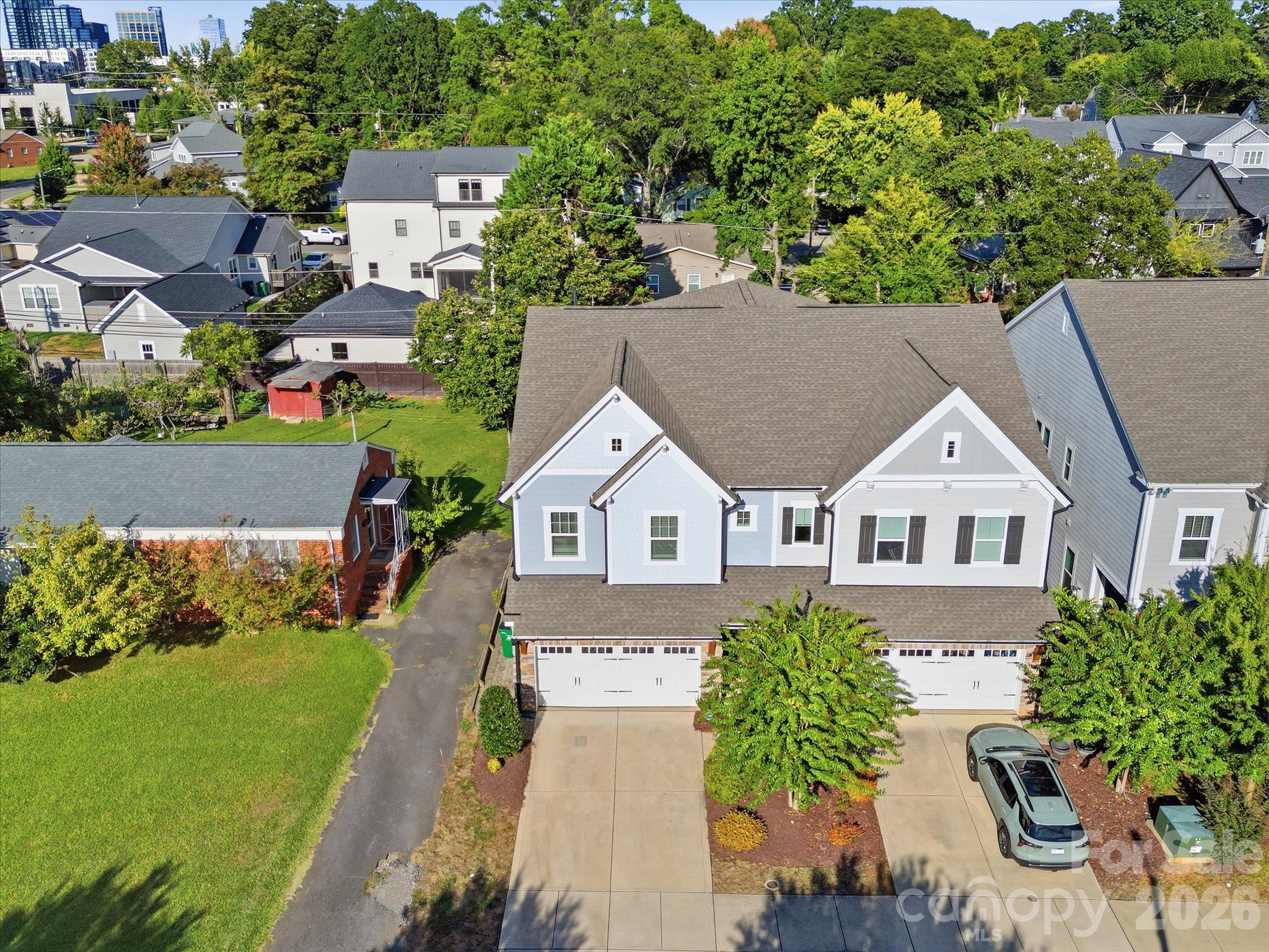 Aerial drone view of 337 Belton St showing the end-unit townhome, two-car garage, and tree-lined street in Charlotte's 28209 zip code, minutes from South End and Uptown Charlotte. - 337 Belton Street, Charlotte