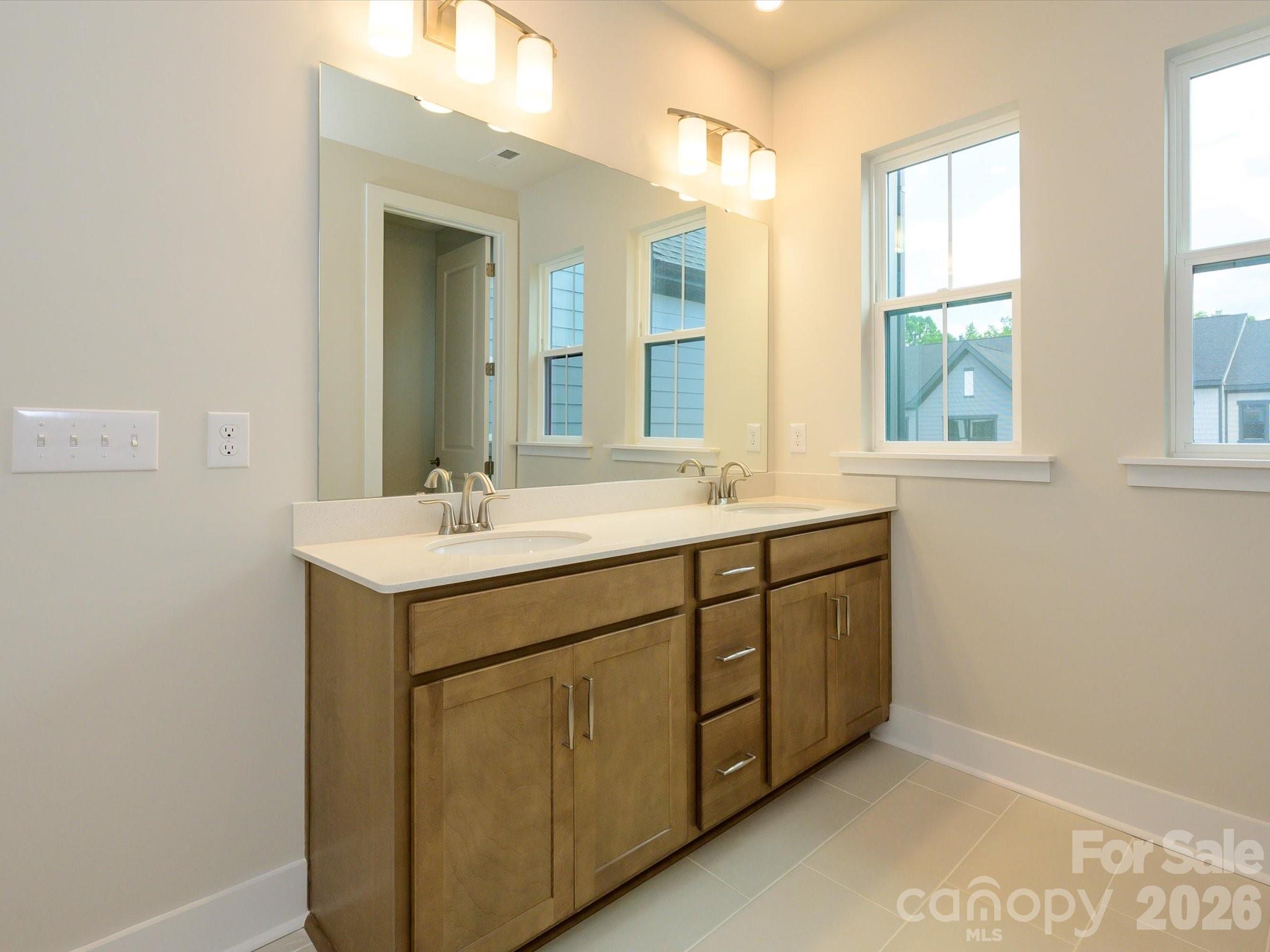 En Suite Primary Bath with Dual Vanity and Loads of Storage Space. - 217 Halemarg Drive, Belmont