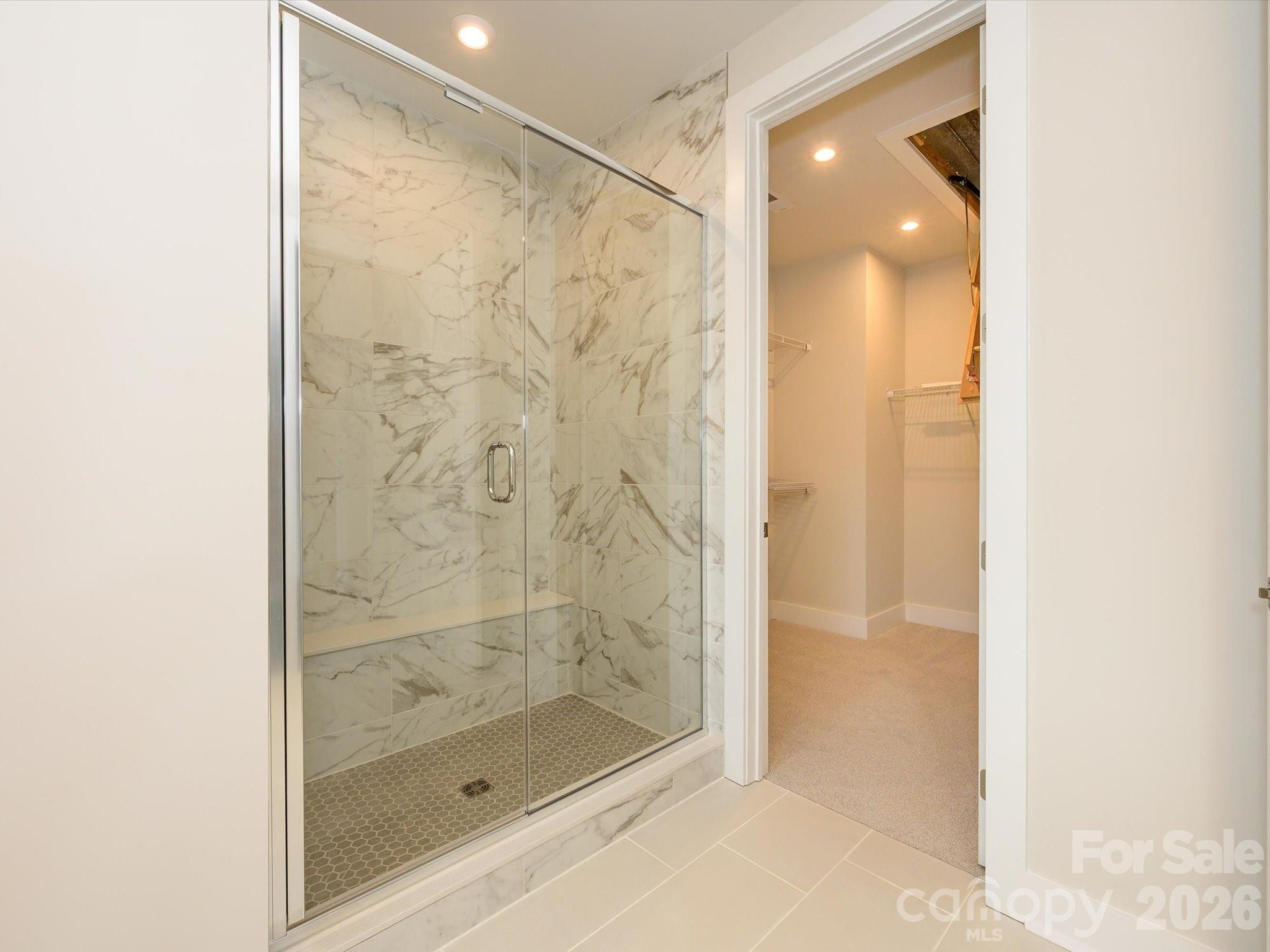 Marble-Look Tile Design at Primary Walk-In Shower. - 217 Halemarg Drive, Belmont