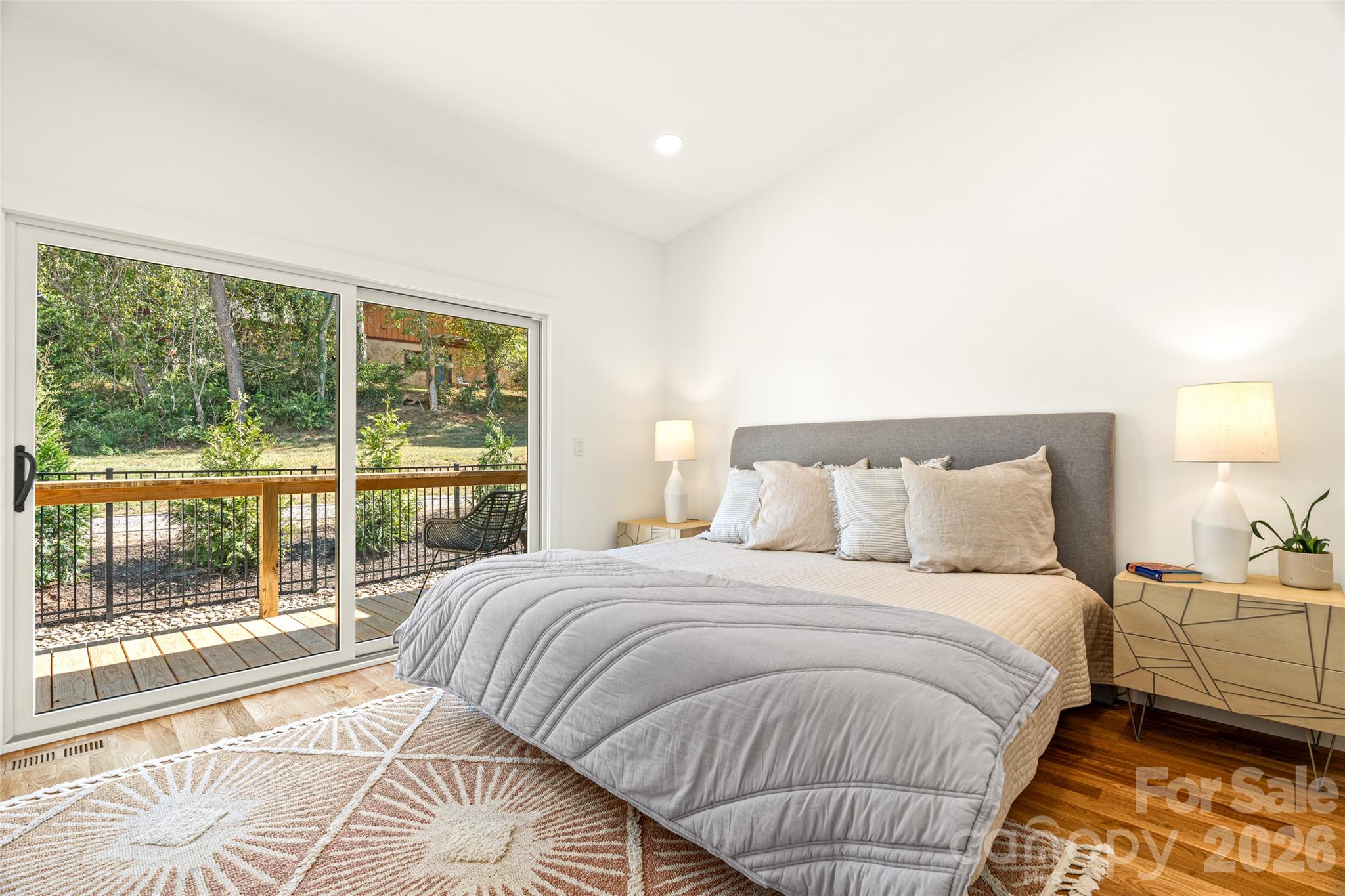 Primary bedroom with view of private deck. - 6 Roberts Street, Asheville