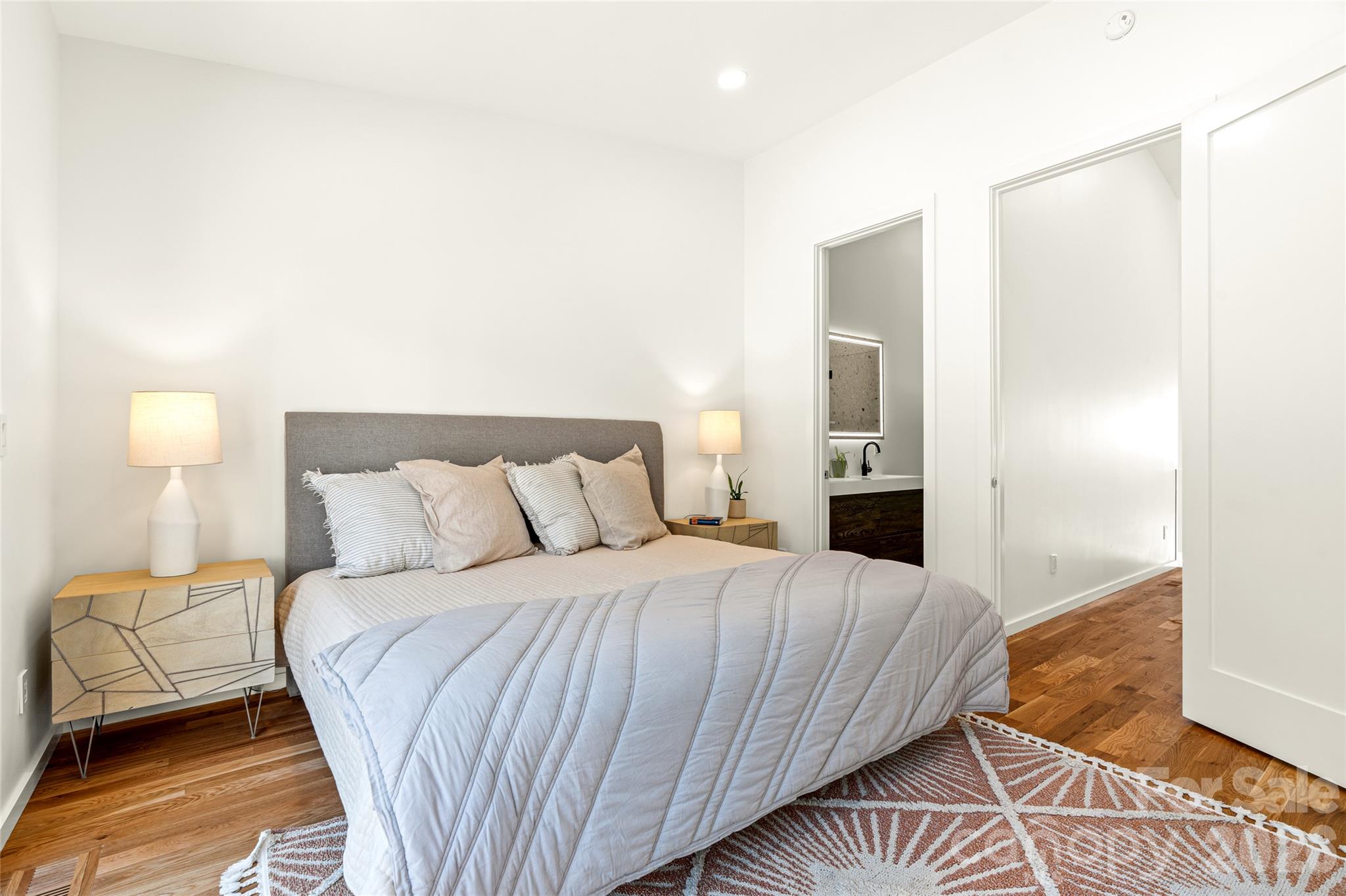 Upper primary bedroom and upper level feature hardwood floors. - 6 Roberts Street, Asheville