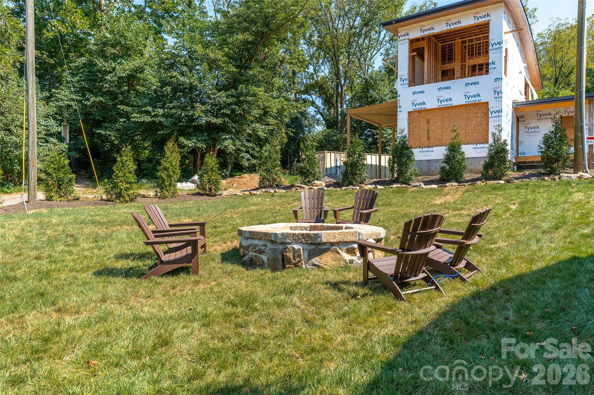 Fire pit and privacy trees at The Treadway. - 6 Roberts Street, Asheville