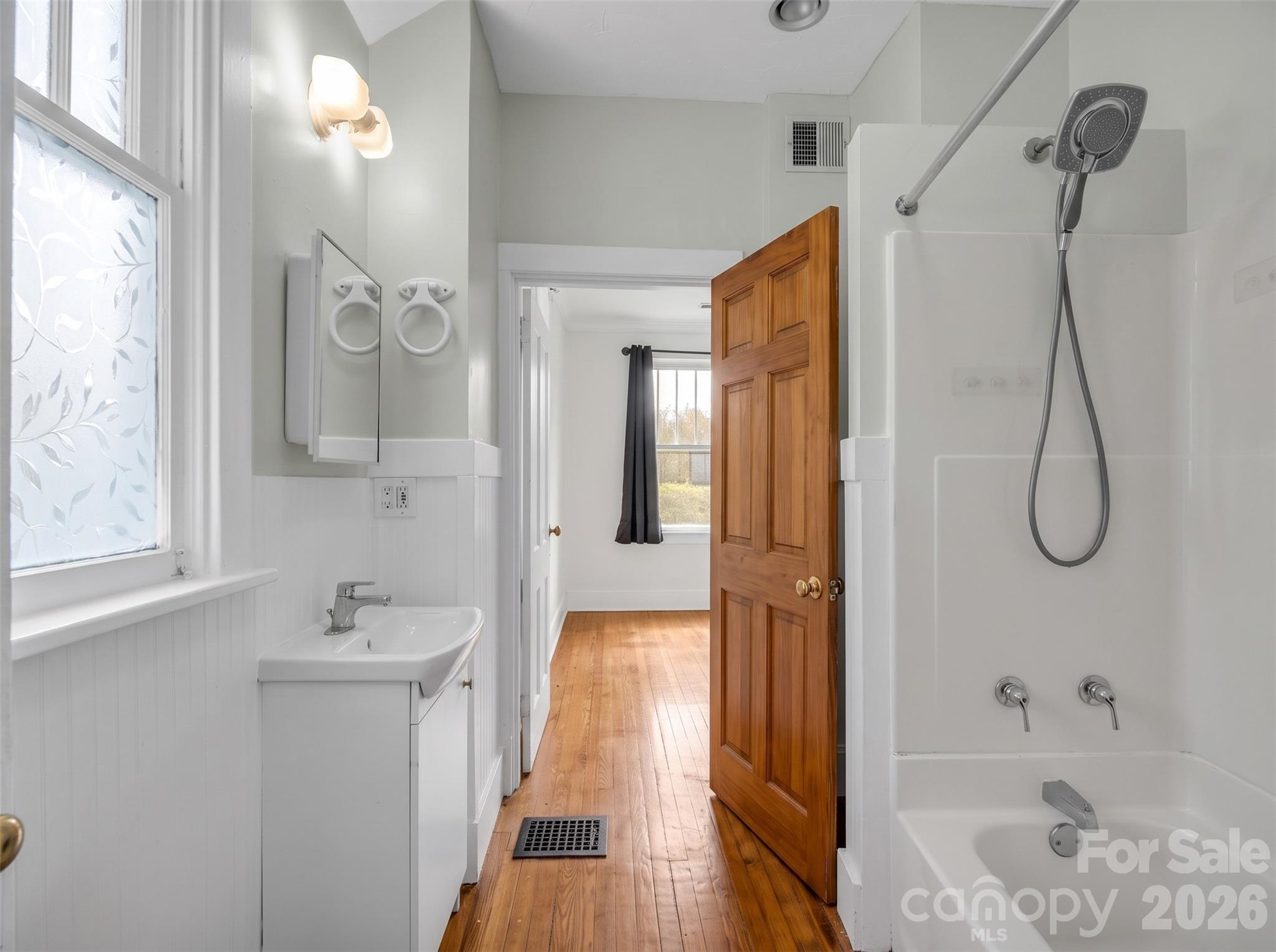 200 main floor bathroomDigitally enhanced - 198 & 200 Courtland Place, Asheville