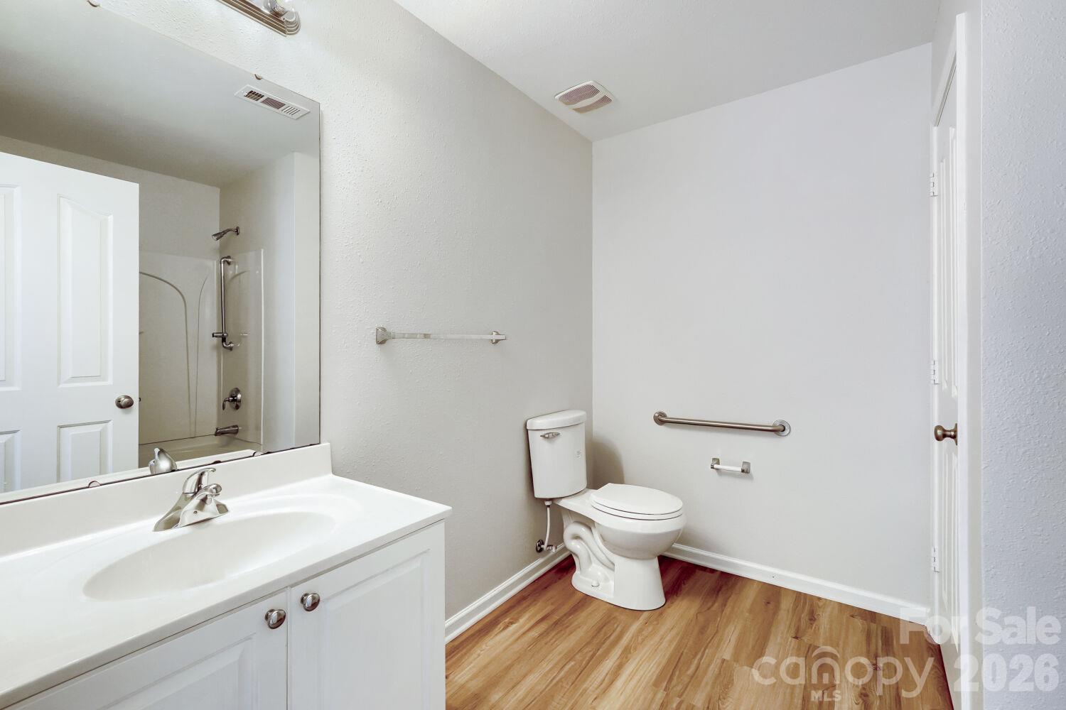 Primary Bathroom with new LPV flooring with Linen closet, nice feature!! - 5135 Raspberry Knoll Drive, Charlotte