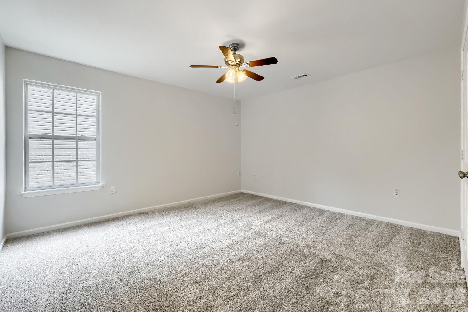 Large Bedroom 2 on the Upper Level, New Carpet & Nice size closet with Ceiling Fan - 5135 Raspberry Knoll Drive, Charlotte