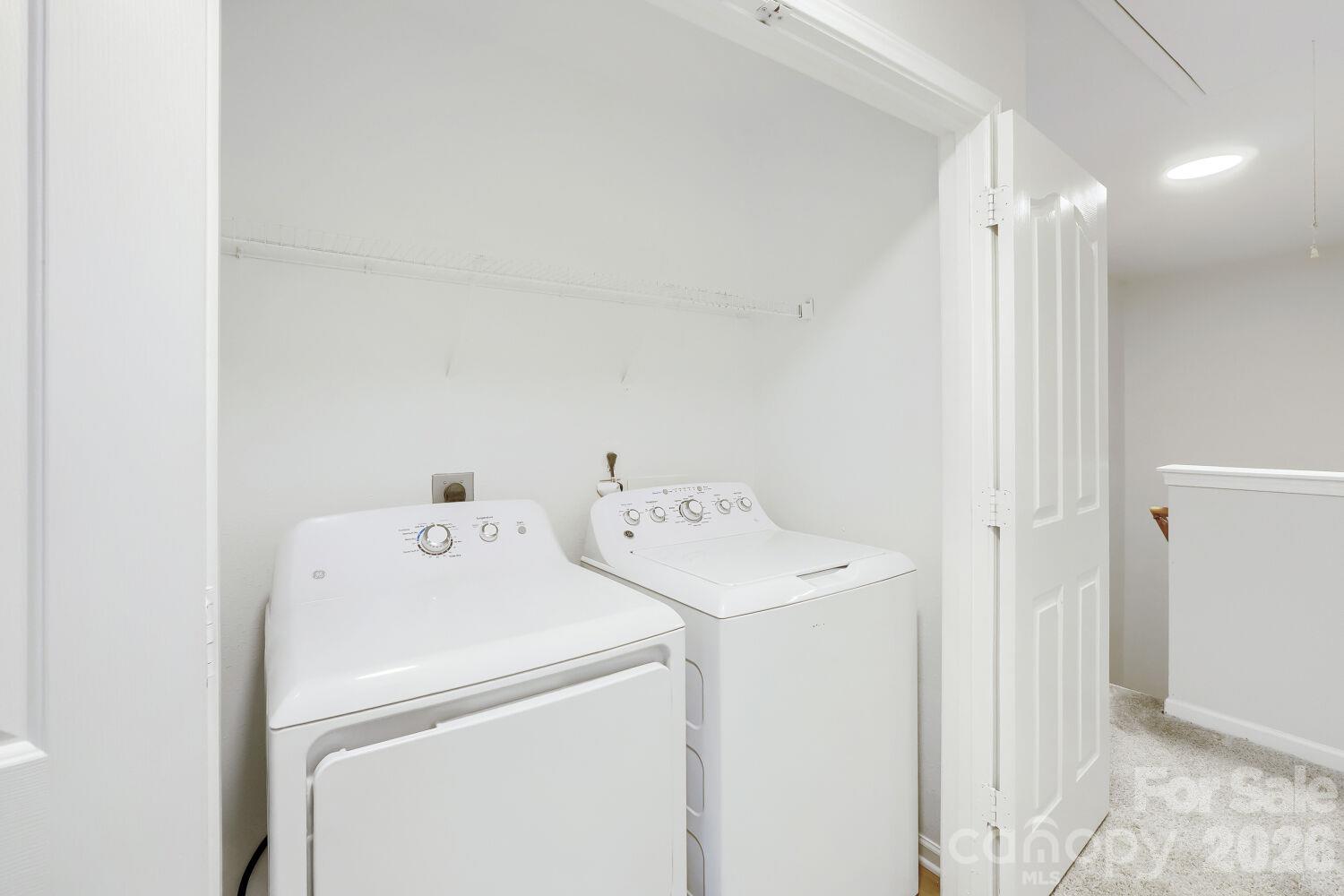 Laundry Room on Upper Level with Washer & Dryer & Linen Closet right across from the Laundry Room - 5135 Raspberry Knoll Drive, Charlotte