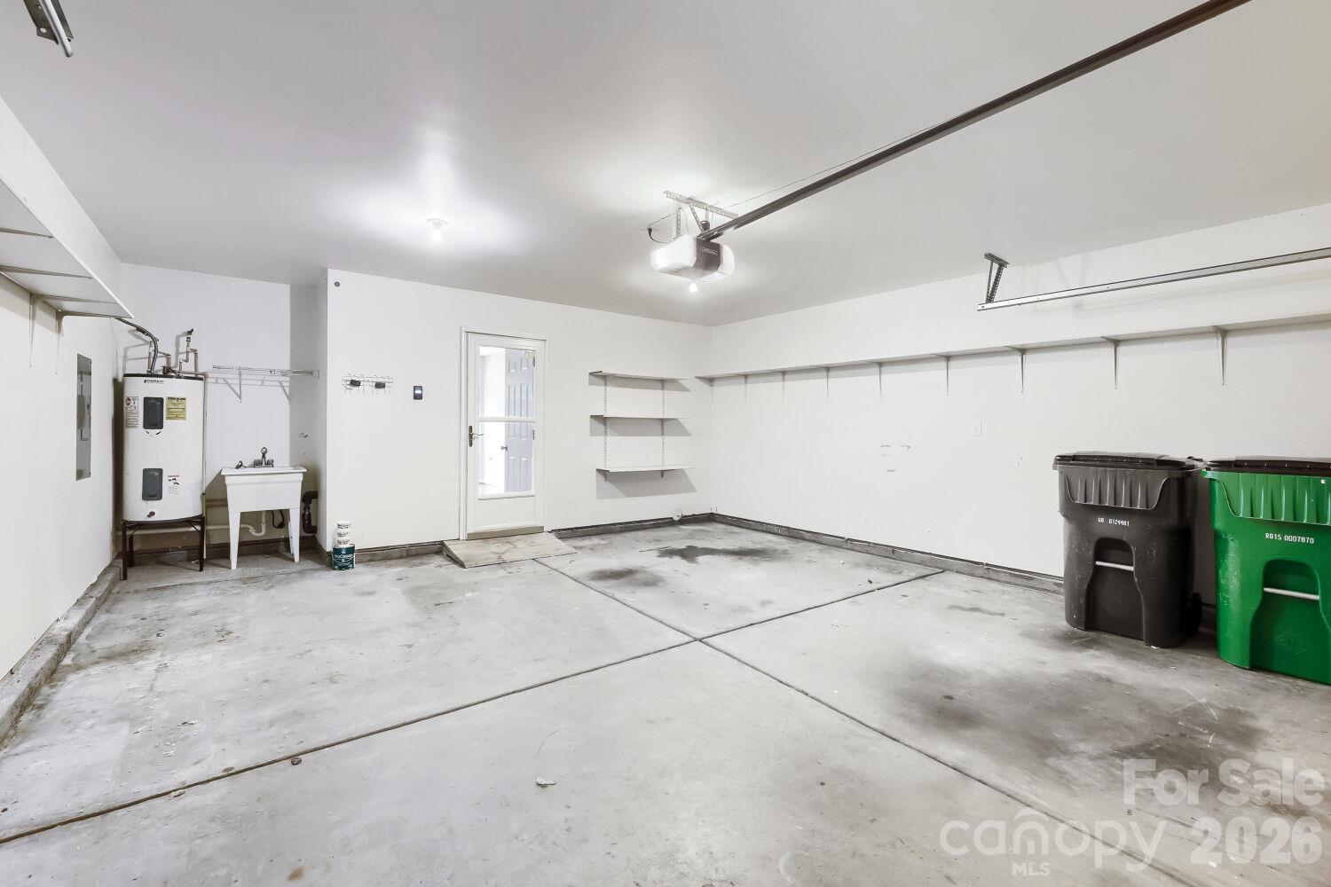 2 Car Garage with Shelving & Utility Sink & Garage Door opener & 2 remotes - 5135 Raspberry Knoll Drive, Charlotte