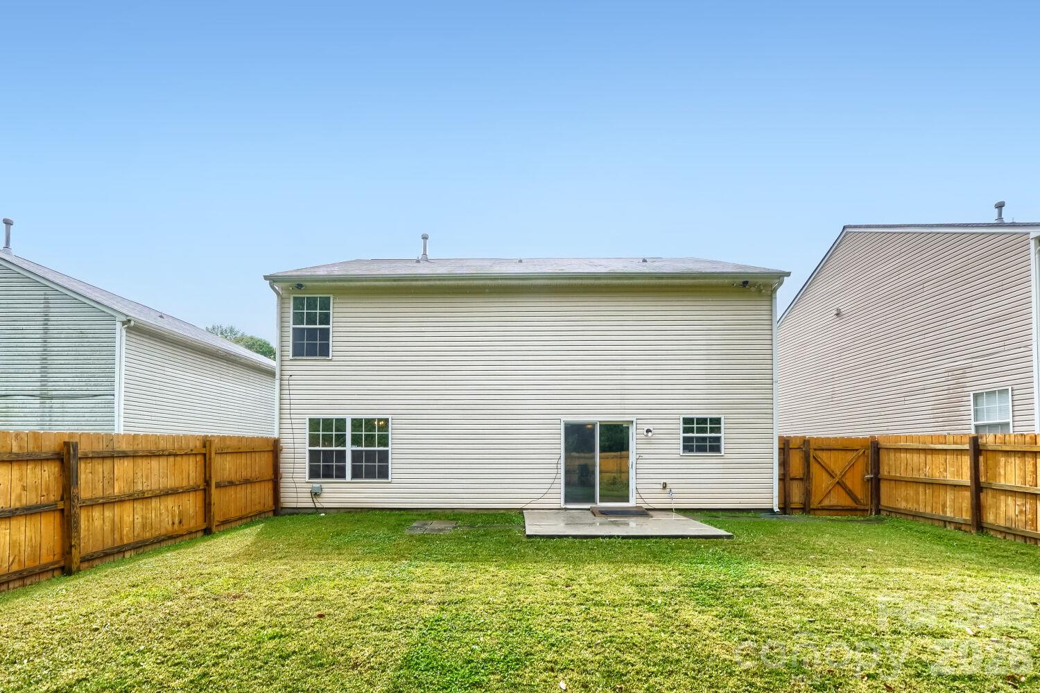 Rear view of the house & Large fenced in back yard - 5135 Raspberry Knoll Drive, Charlotte