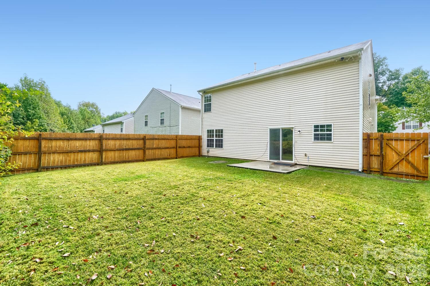 Rear view of the house & Large fenced in back yard - 5135 Raspberry Knoll Drive, Charlotte