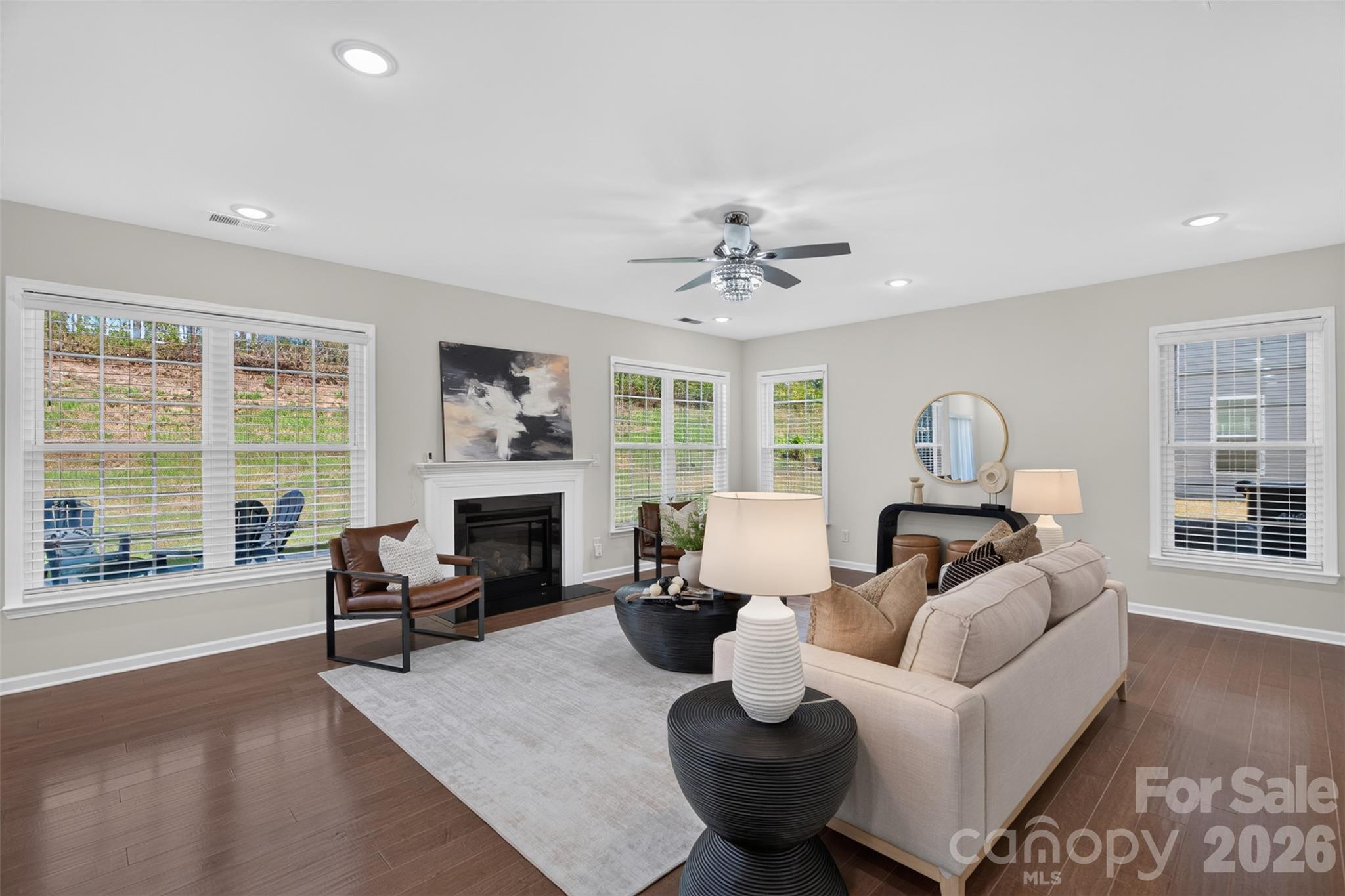 Light-filled family room with cozy gas fireplace. - 4638 Monument Valley Drive, Indian Land
