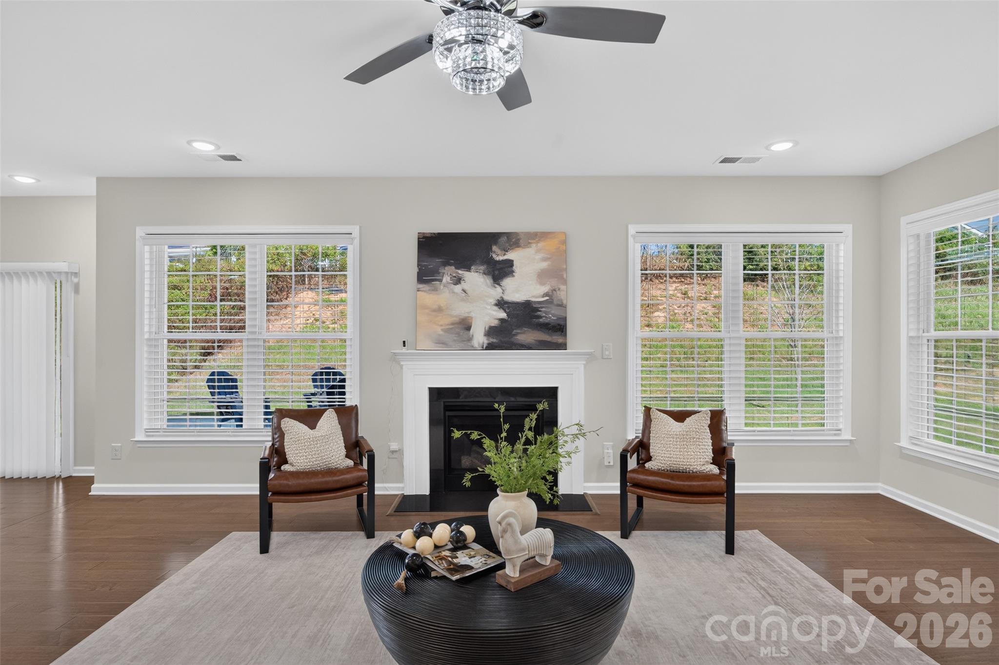 Light-filled family room with gas fireplace. - 4638 Monument Valley Drive, Indian Land
