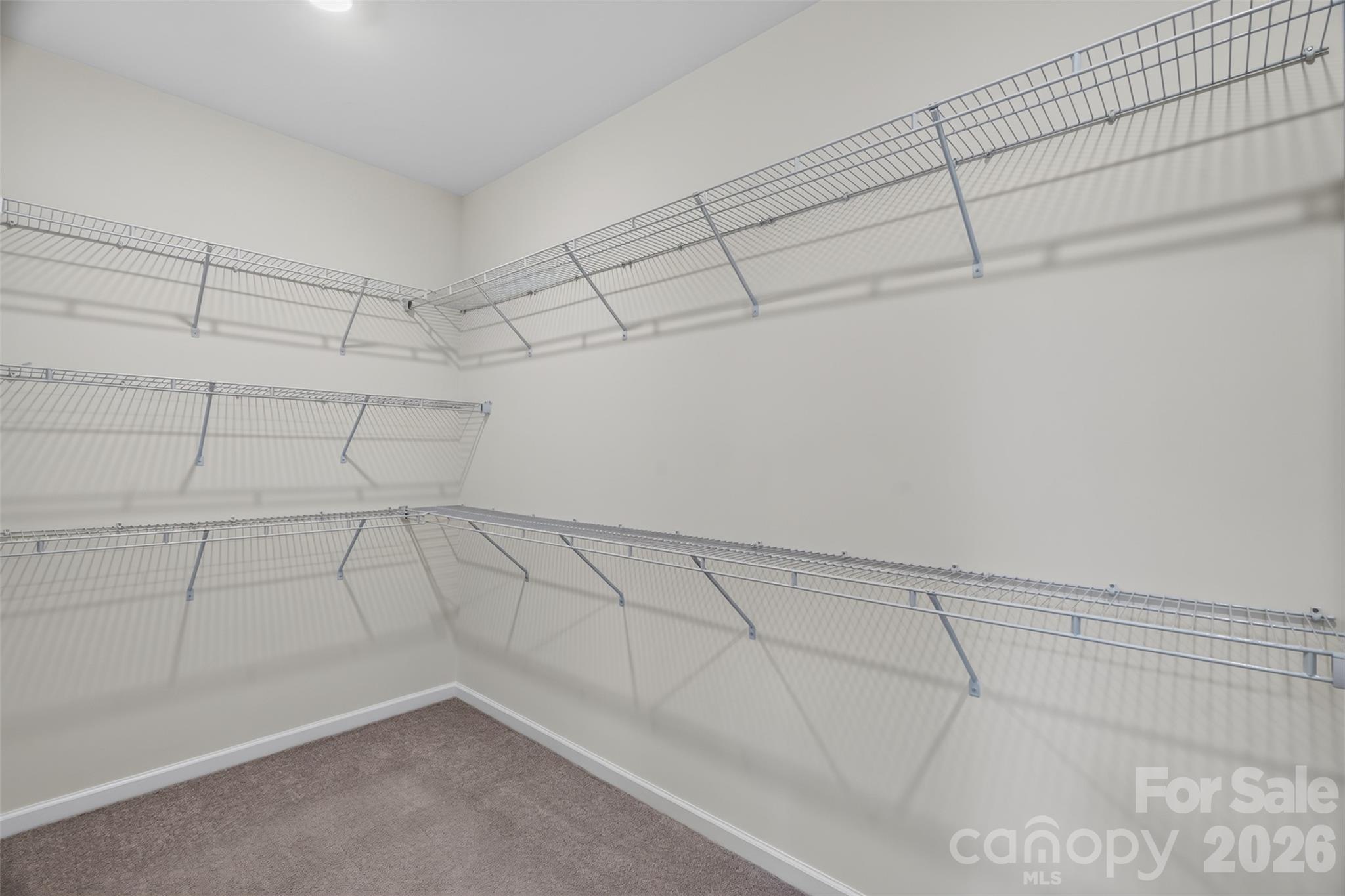 Large primary bedroom closet for ample storage. - 4638 Monument Valley Drive, Indian Land