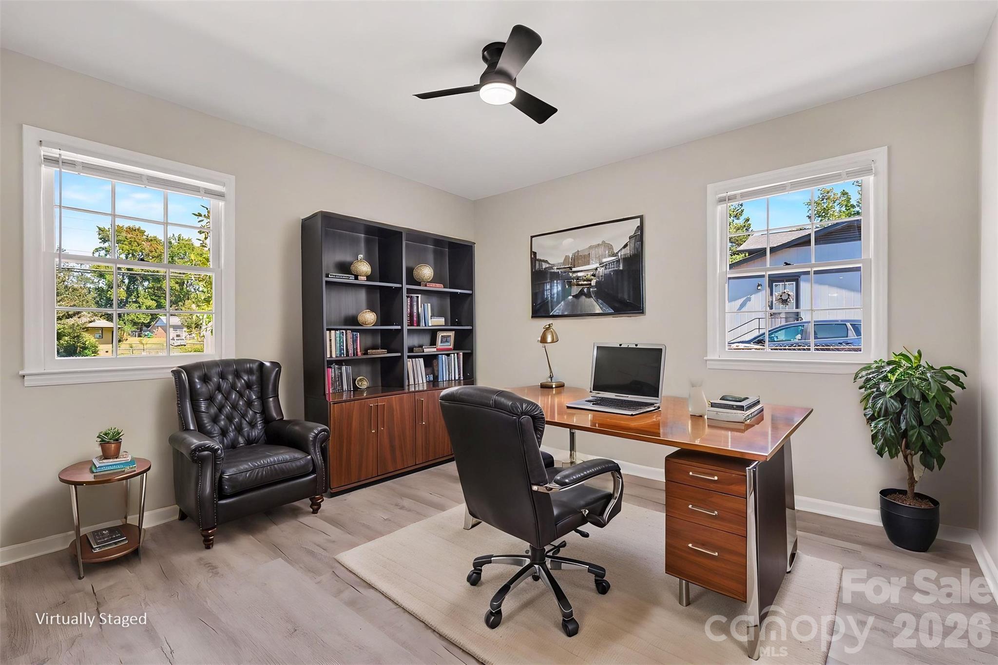 Spacious bedroom highlighted by double windows for ample natural light, fresh paint, and updated flooring. ( Virtually Stageg) - 3801 Hillock Court, Charlotte