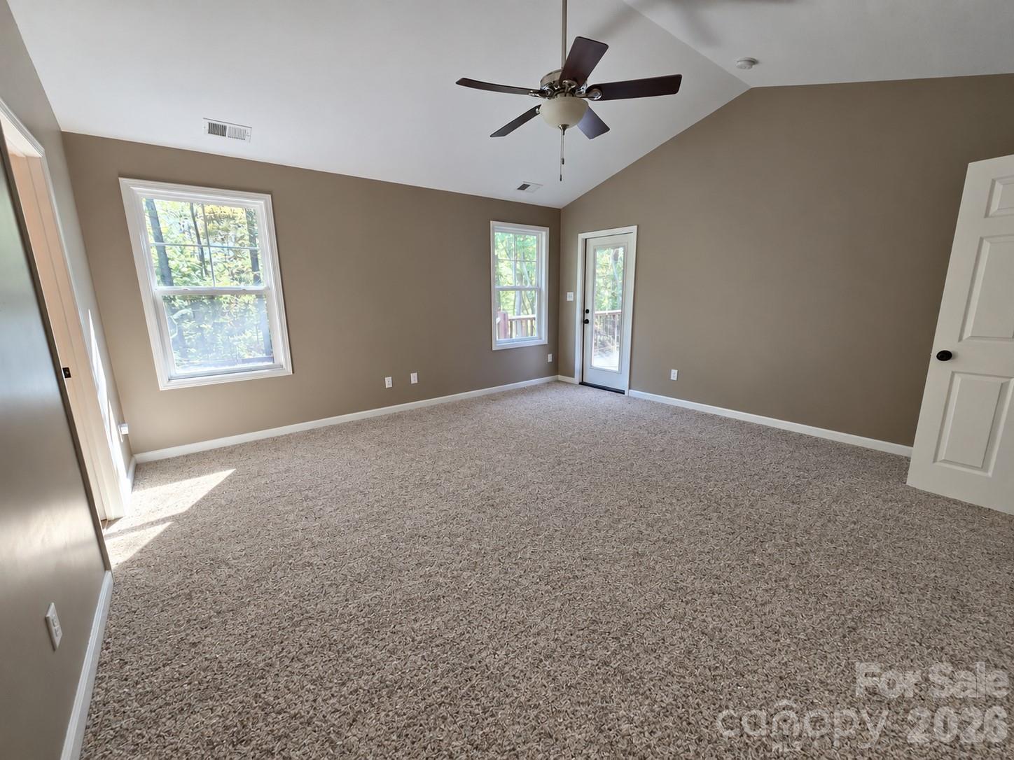 Primary bedroom with exterior door to back deck - 15 Tiki Way, Candler