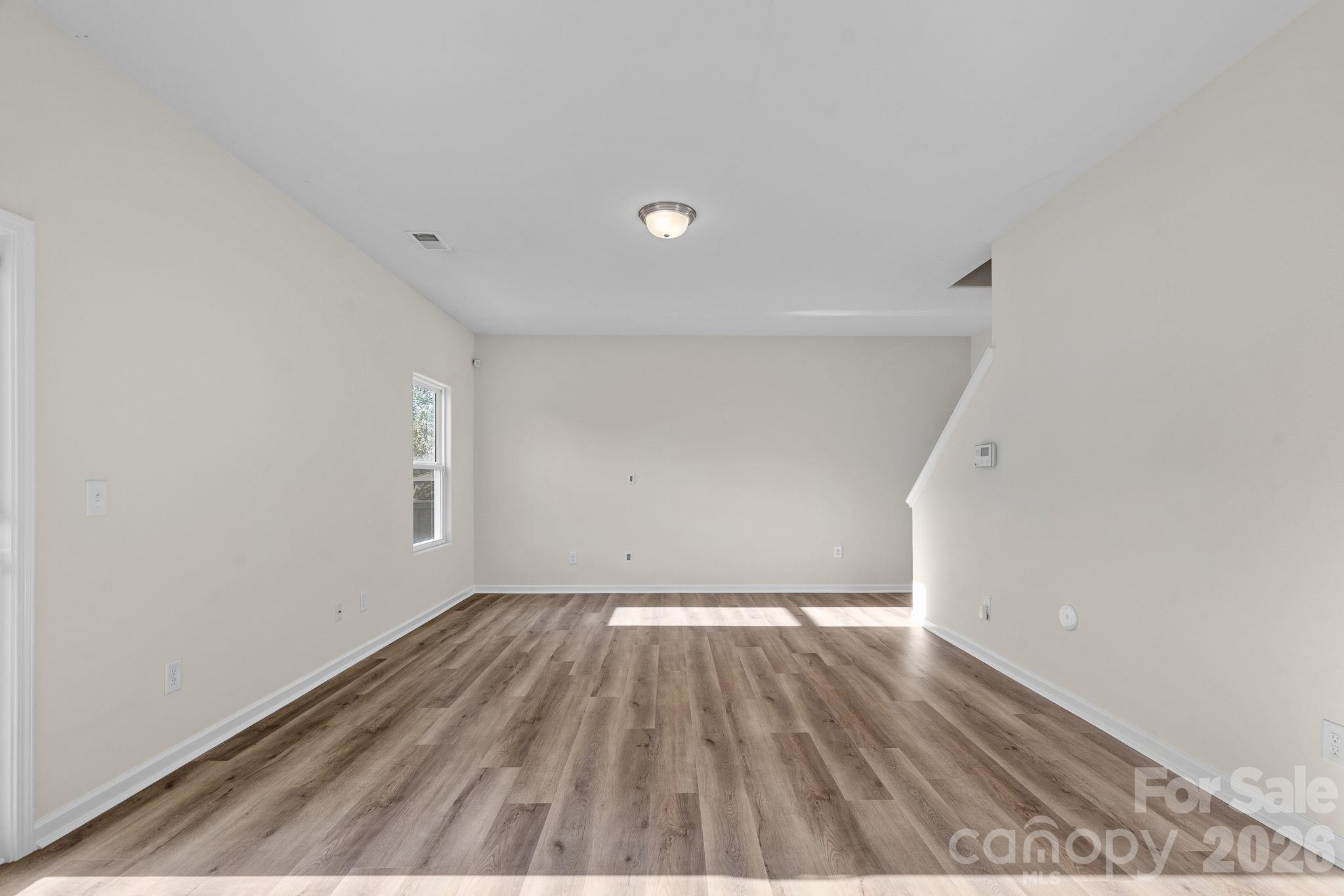 Living room without virtual staging - 6215 Paw Village Road, Charlotte