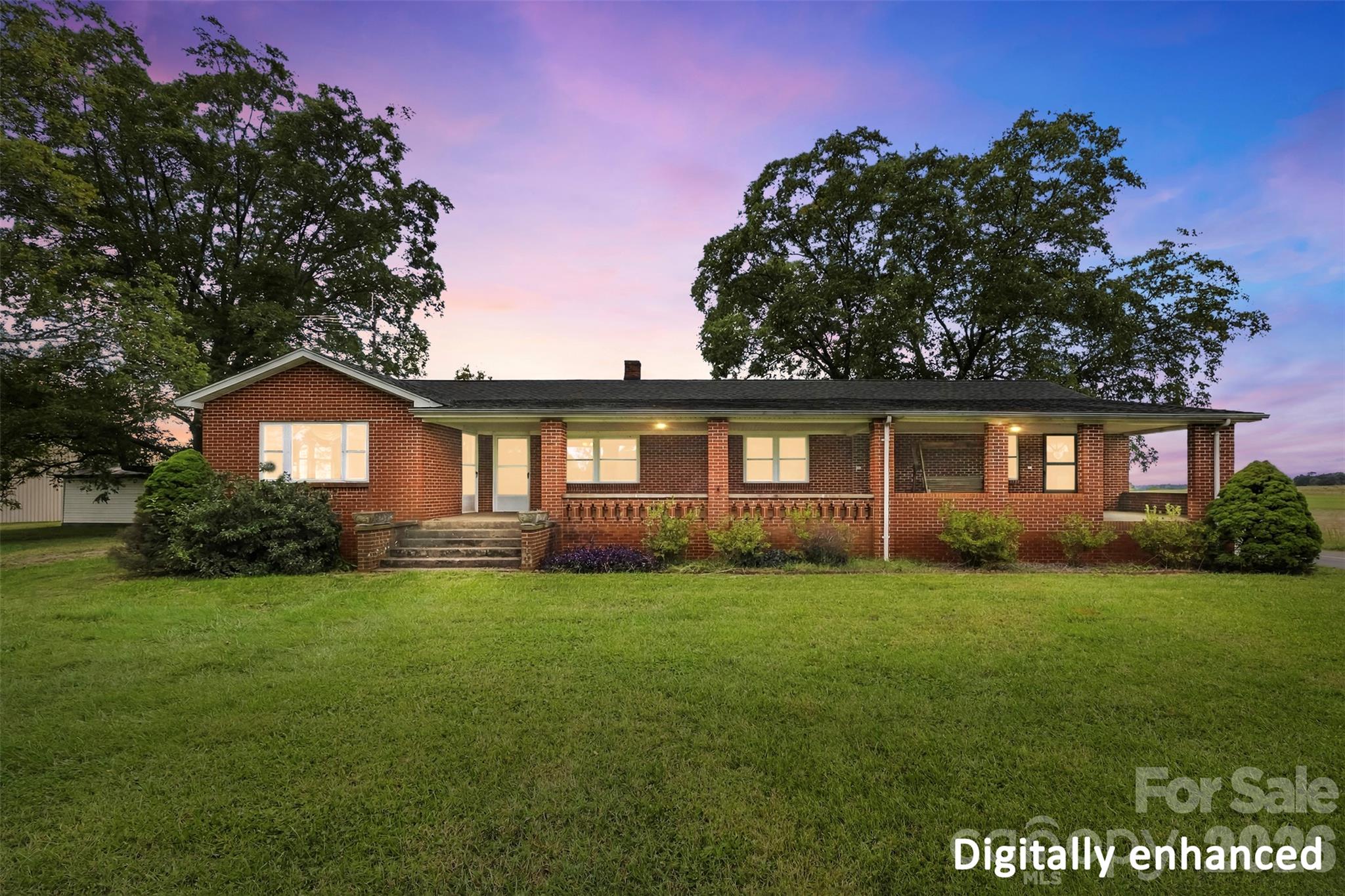 The large covered porch offers space for rocking chairs, relaxing, and enjoying the surrounding countryside! - 2925 Fallston Waco Road, Shelby