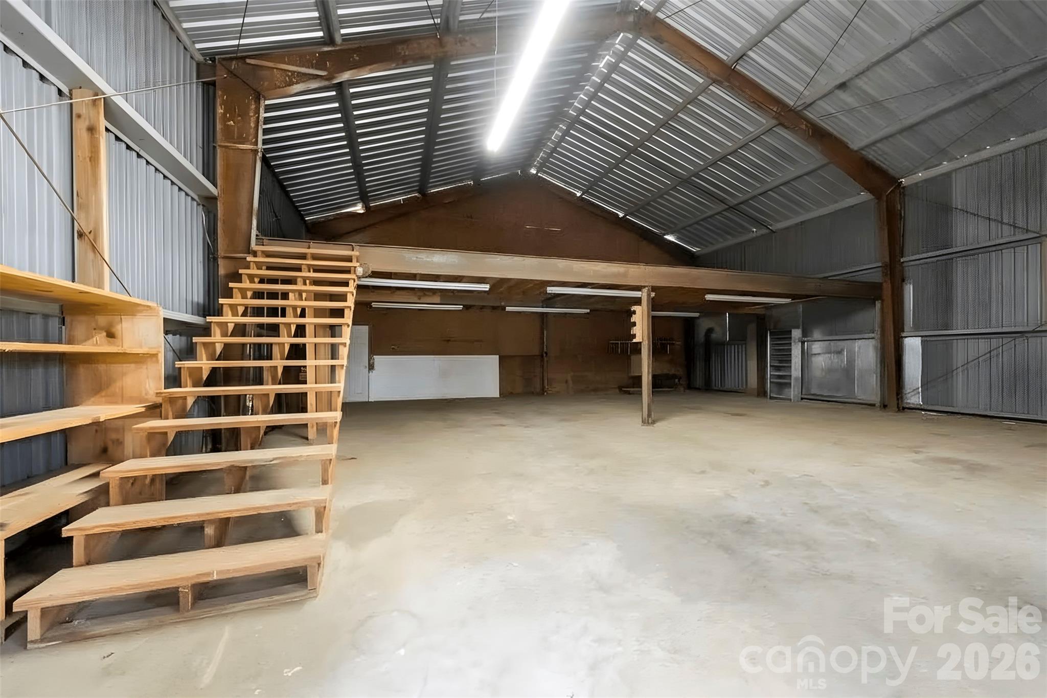 One side of shop building has stairs to a loft - 2925 Fallston Waco Road, Shelby