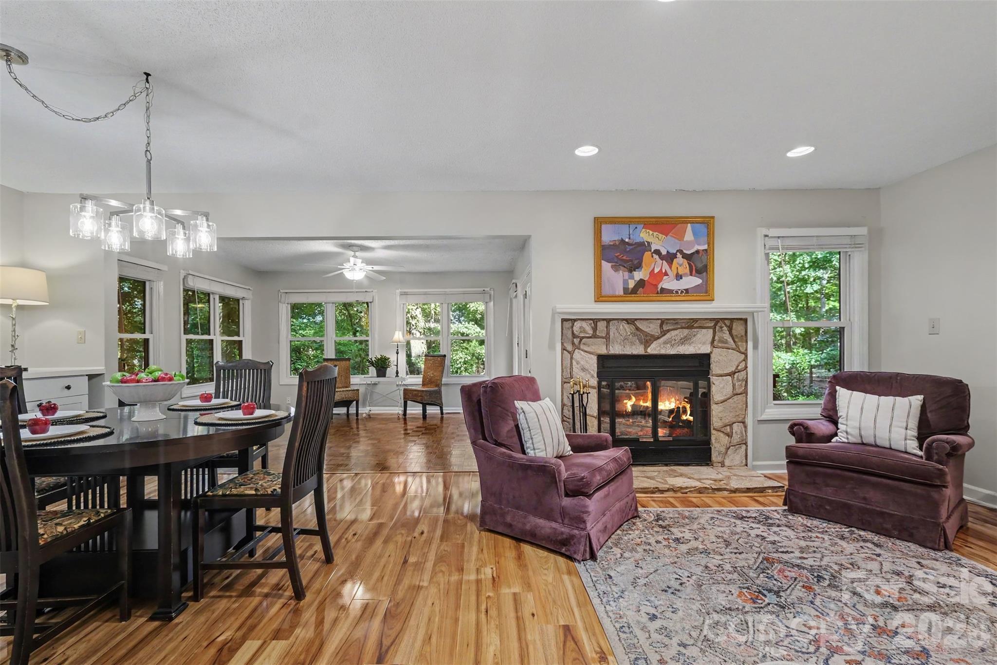 Open living and dining area flow into the  sunroom - 2786 Dogwood Hills Court, Fort Mill