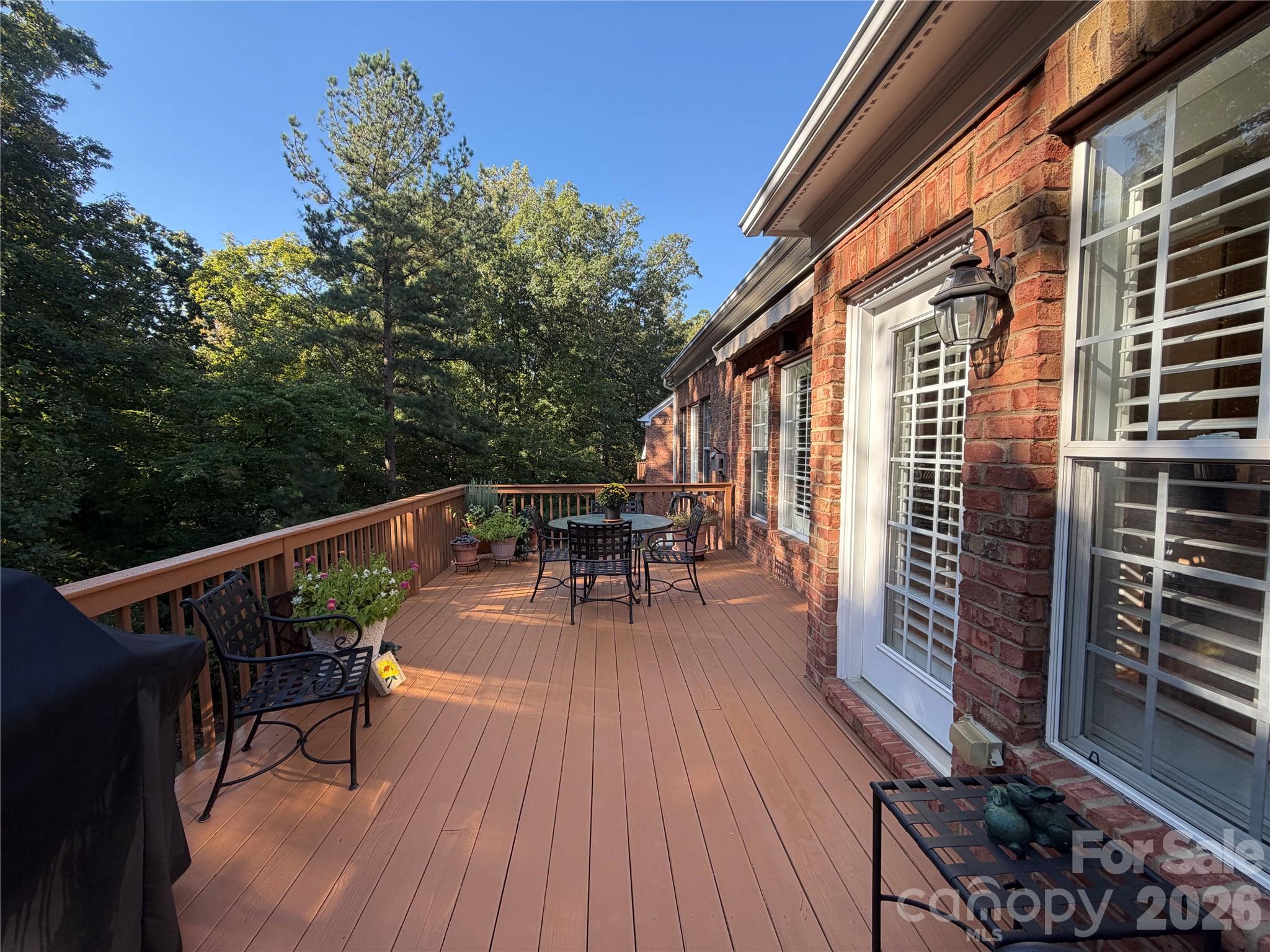 Private 20-foot deck with gas line for grill and retractable awning. - 11437 Corliss Avenue, Charlotte