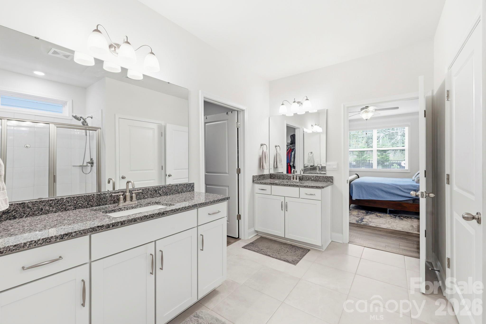 Primary bathroom connects to primary and second  bedroom - 451 Fox Cove Cove, Hendersonville