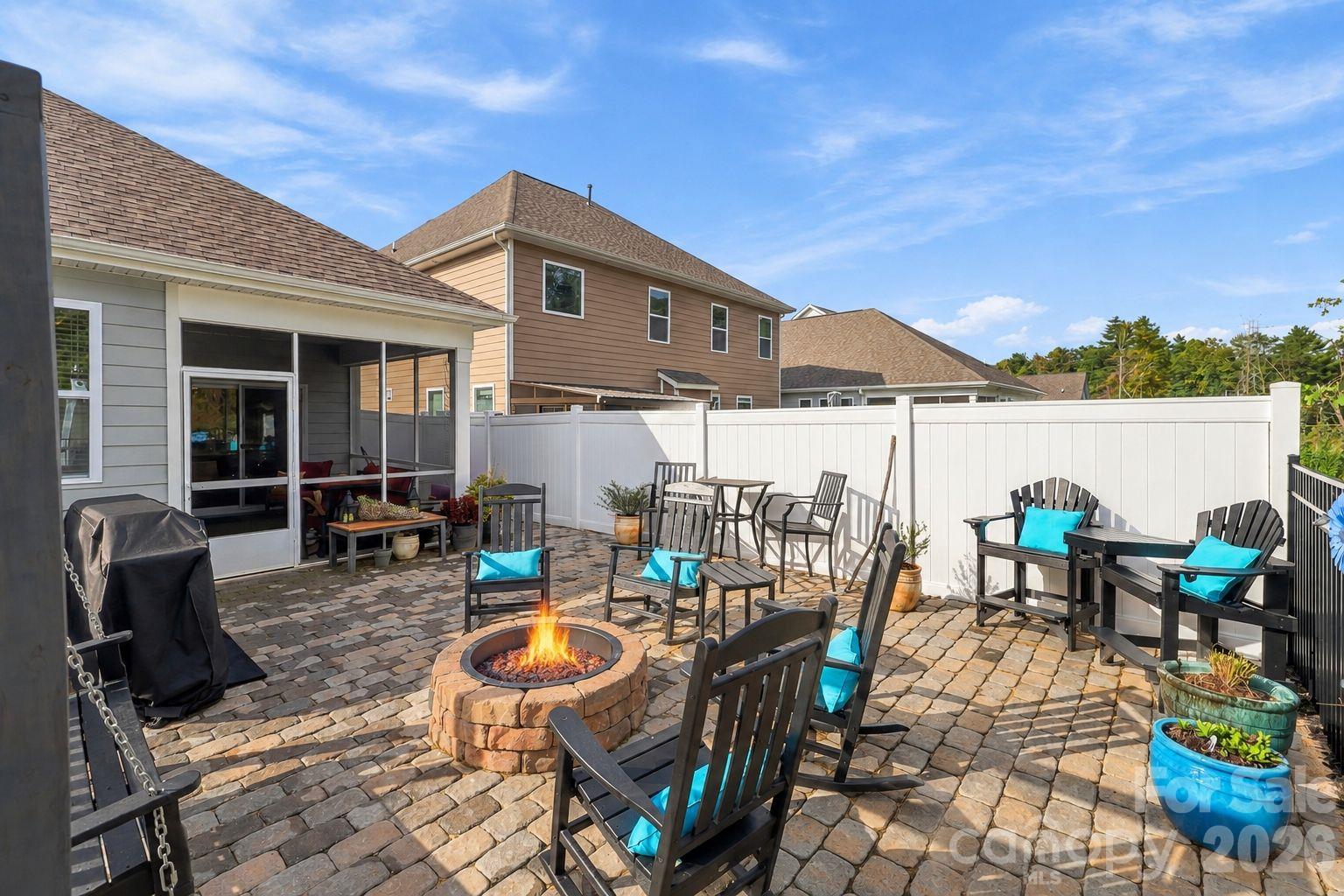 Beautiful fenced in backyard with pavers and build in fireplace - 451 Fox Cove Cove, Hendersonville