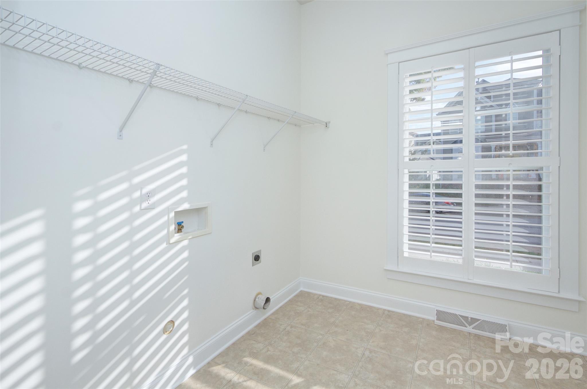 Large laundry room downstairs - 16418 Spruell Street, Huntersville