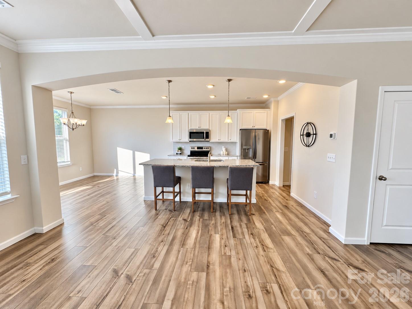 Open concept living with a seamless flow into the kitchen. - 8149 Merryvale Lane, Charlotte