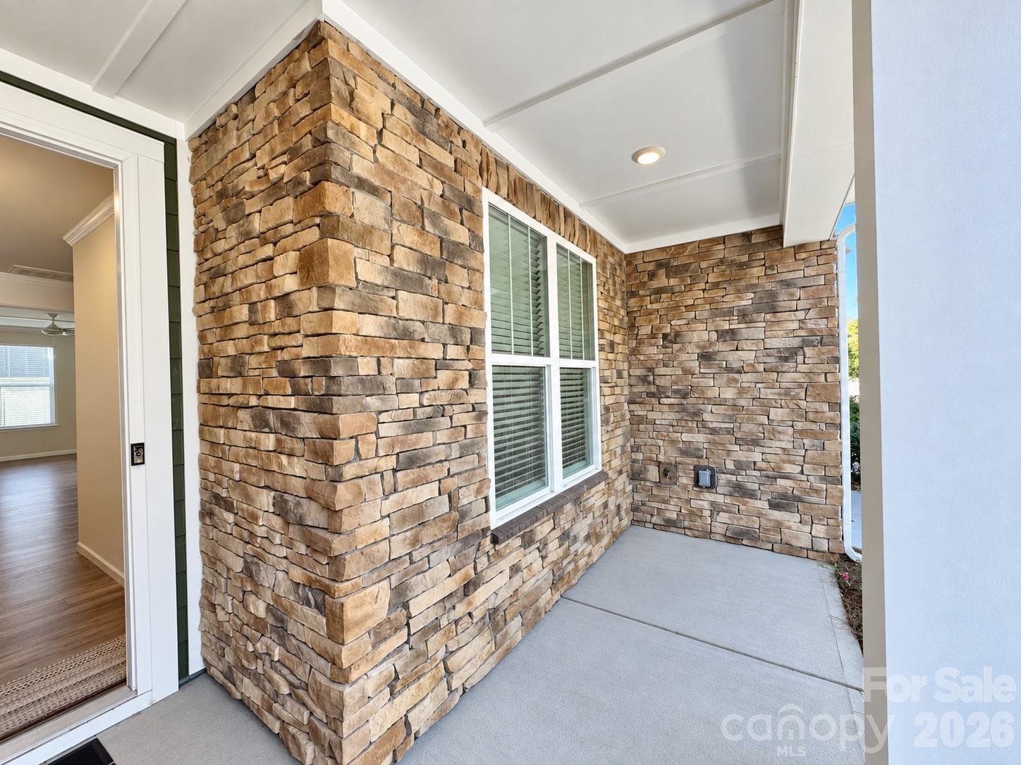 Charming front porch with room to unwind. - 8149 Merryvale Lane, Charlotte