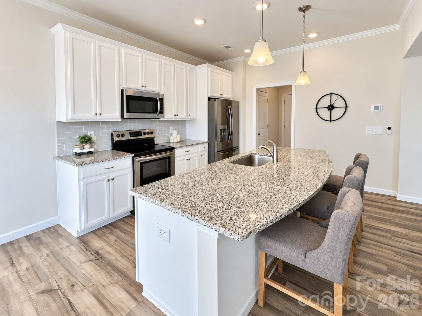 Gather around the generous island. - 8149 Merryvale Lane, Charlotte