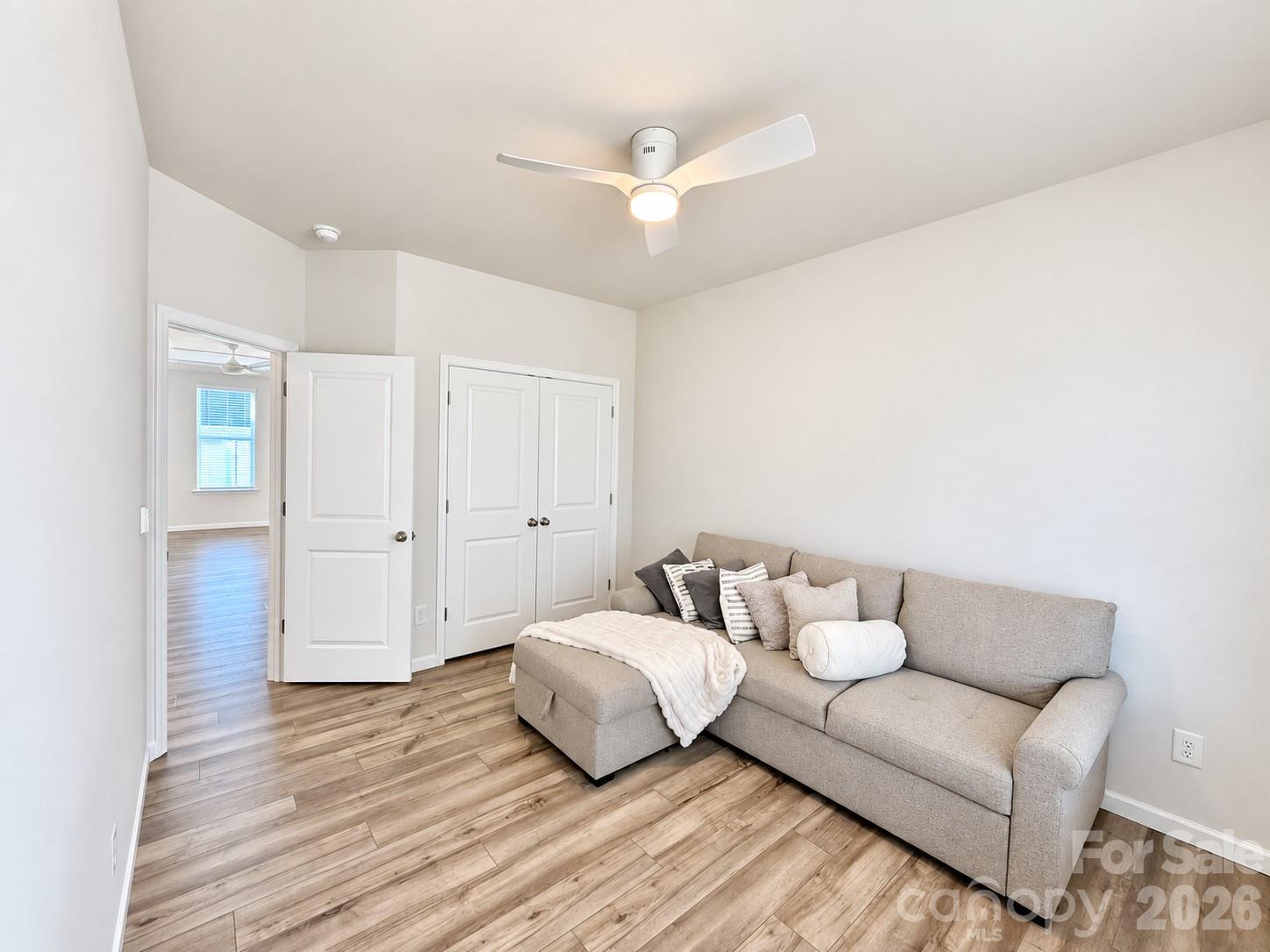 Bedroom on the main floor. Flexible space for a bedroom, home office, or movie room. - 8149 Merryvale Lane, Charlotte