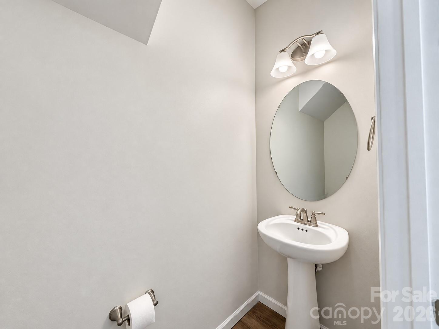 Half bath on the main floor. - 8149 Merryvale Lane, Charlotte