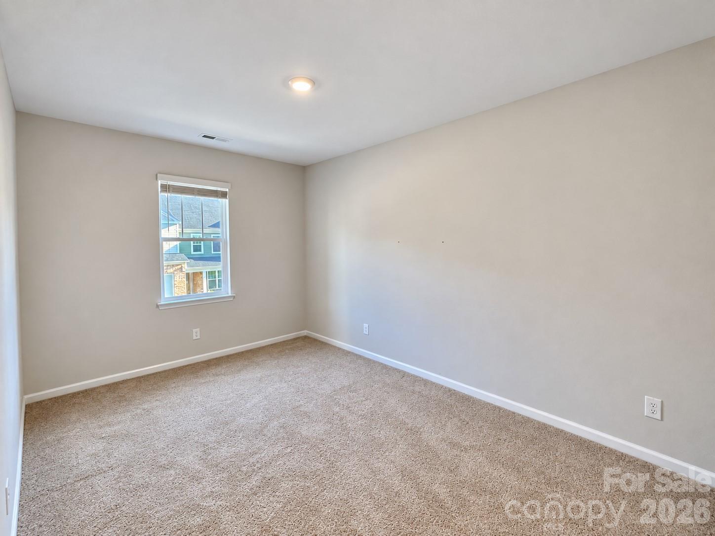 Third bedroom upstairs. Comfortable space for family or guests. - 8149 Merryvale Lane, Charlotte