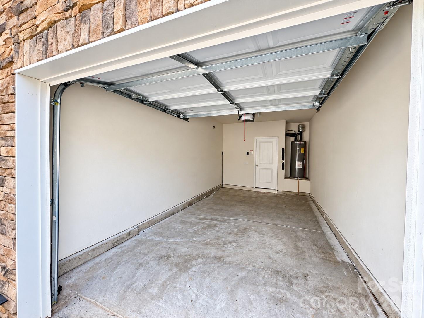 Attached one-car garage for everyday convenience. - 8149 Merryvale Lane, Charlotte