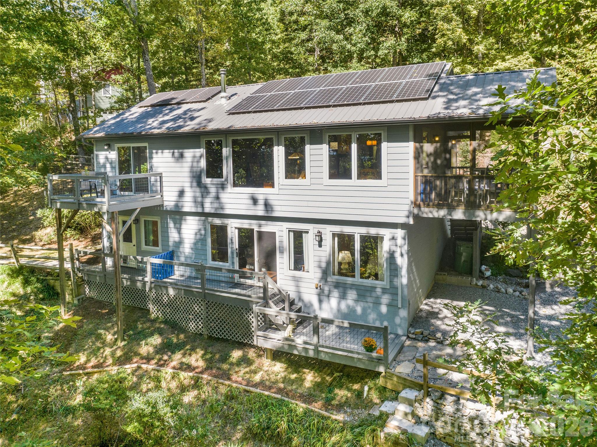 Lots of windows to take advantage of the year round views including fall colors and long range mountain views. - 115 Laurel Wood Drive, Mars Hill