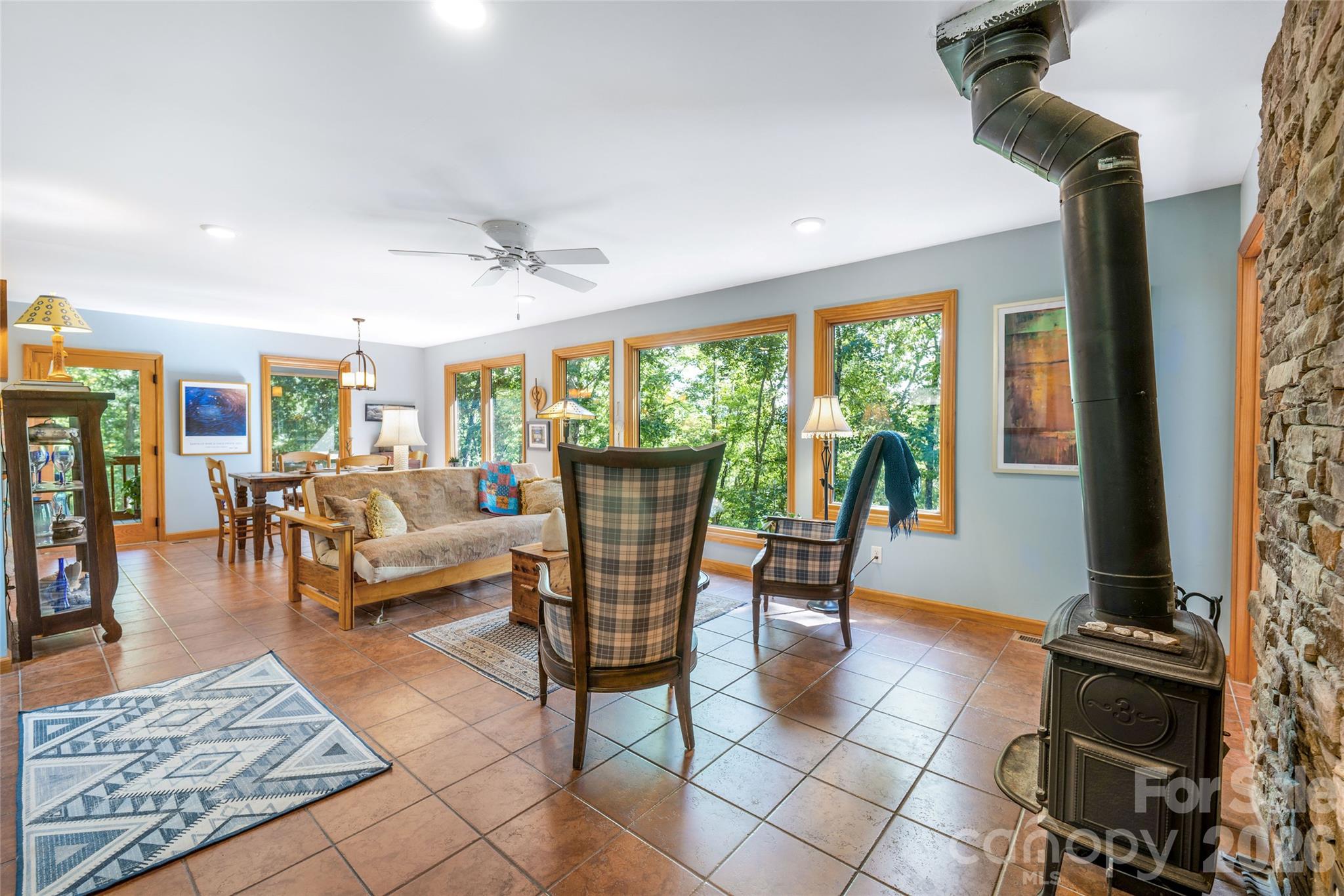 Living room with Jotul wood stove. - 115 Laurel Wood Drive, Mars Hill