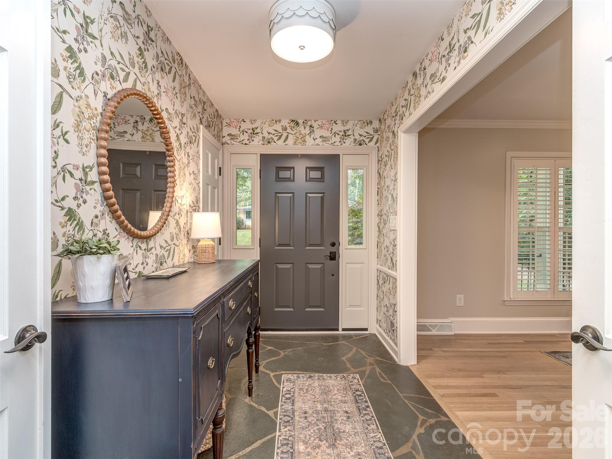 The slate foyer welcomes you into this completely updated and reimagined home! - 6129 Page Court, Charlotte
