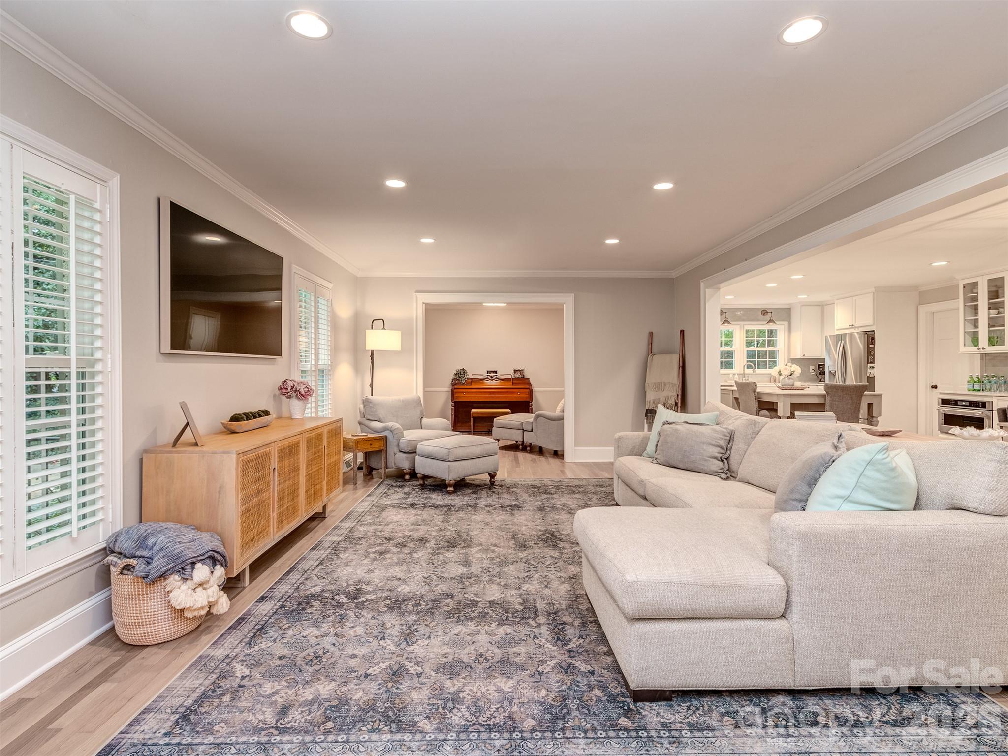 New electrical throughout is showcased by the extensive recessed lighting in all of the main living areas! - 6129 Page Court, Charlotte