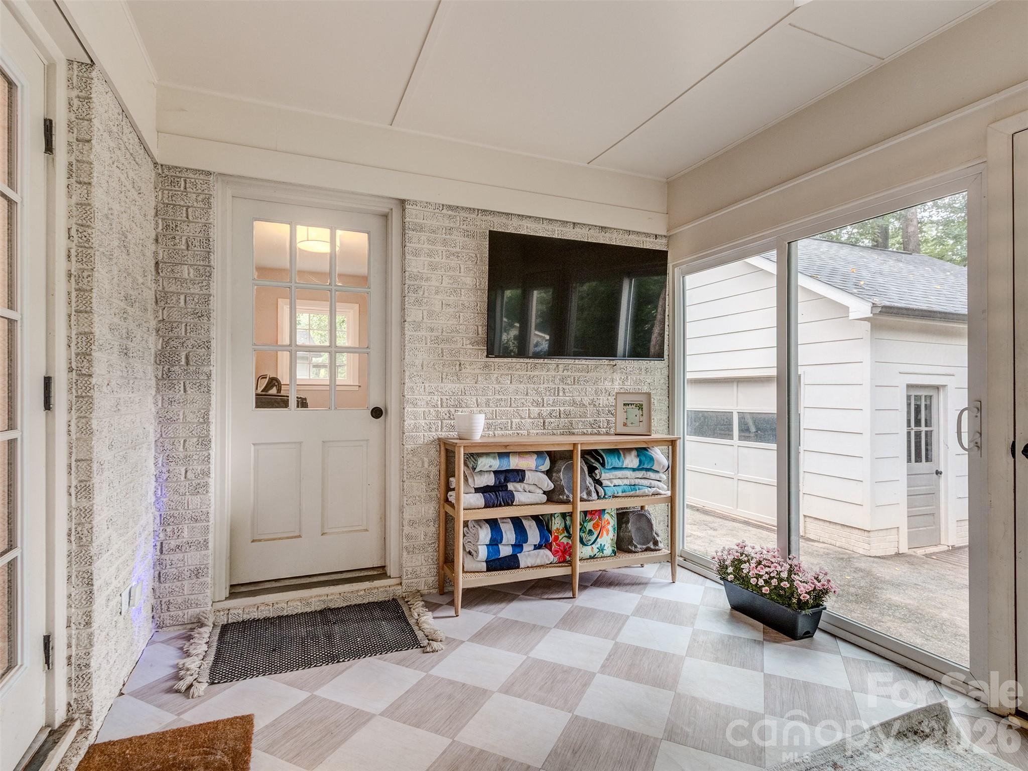 The sun room is the perfect place for a nap year round! Whether Spring is in the air or Winter Snow is falling outside, you will never be uncomfortable here! - 6129 Page Court, Charlotte