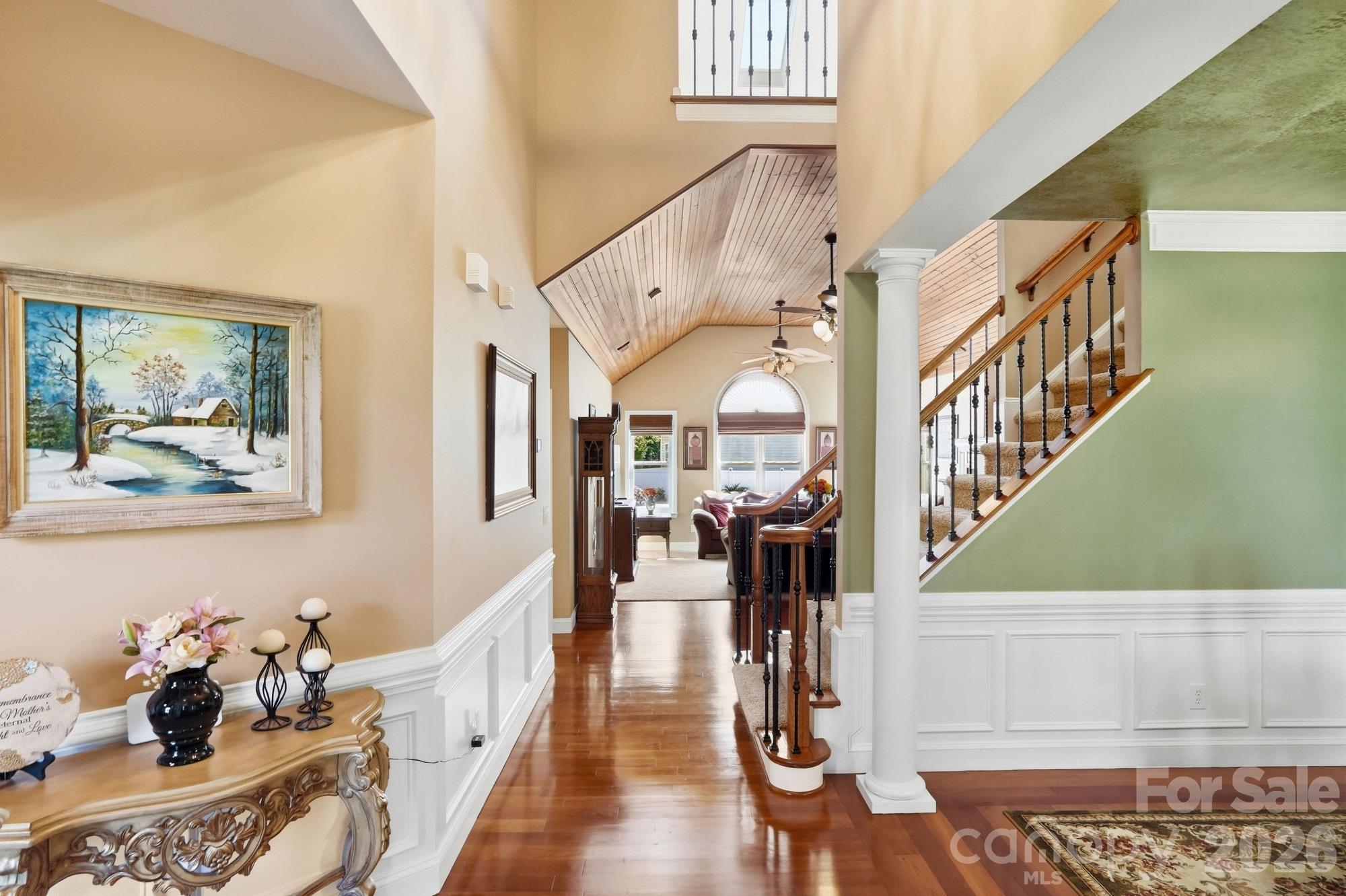 When you enter the front door, you are greeted by a warm palate, custom side stairs, a beautiful dining room and looking into the vaulted great room with custom wood ceiling. It says 'Welcome Home'! - 120 Harris Farm Road, Mooresville