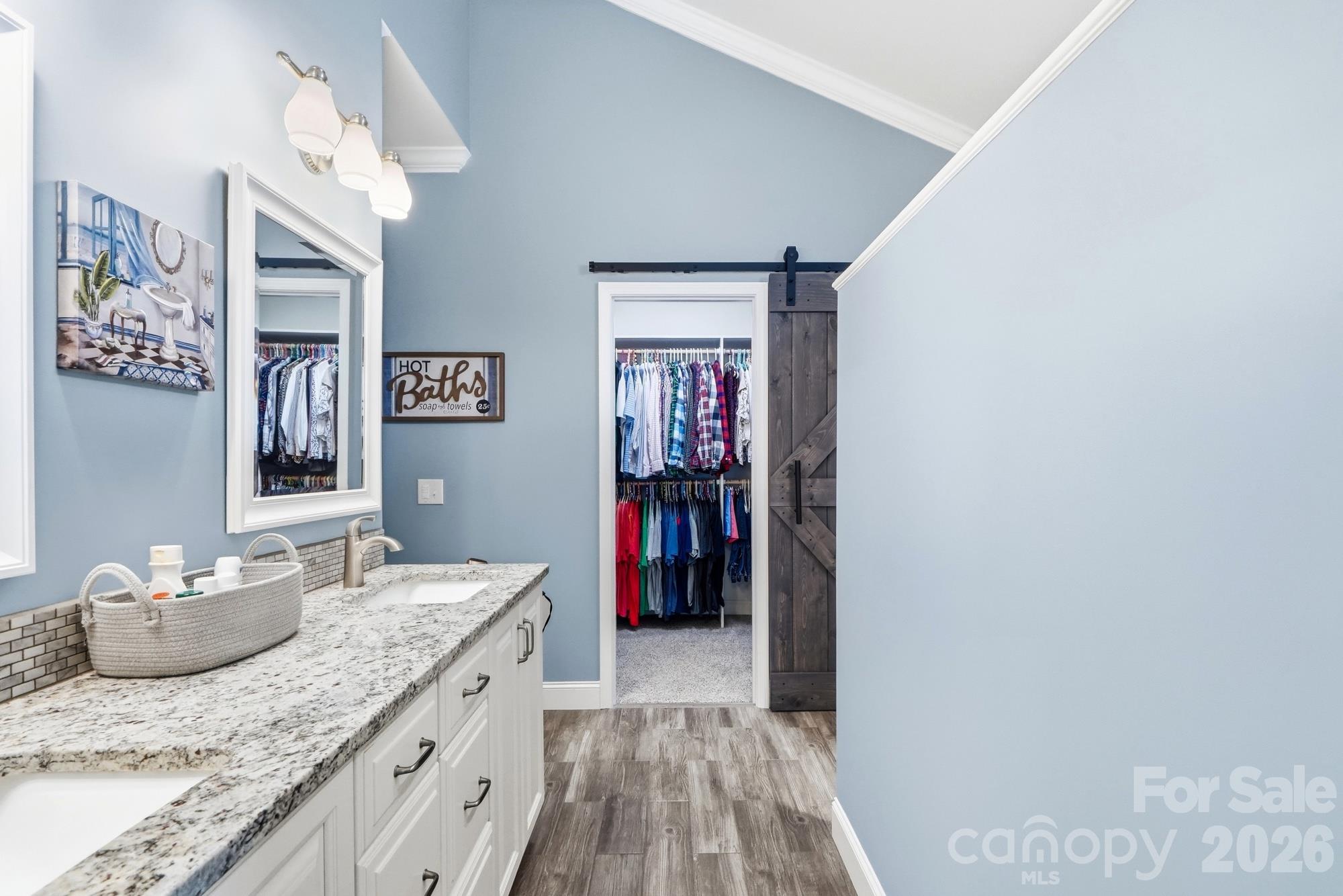 Primary bathroom has been fully remodeled and reconfigured. The walk in closet has been finished with a closet system to make organization a dream! - 120 Harris Farm Road, Mooresville