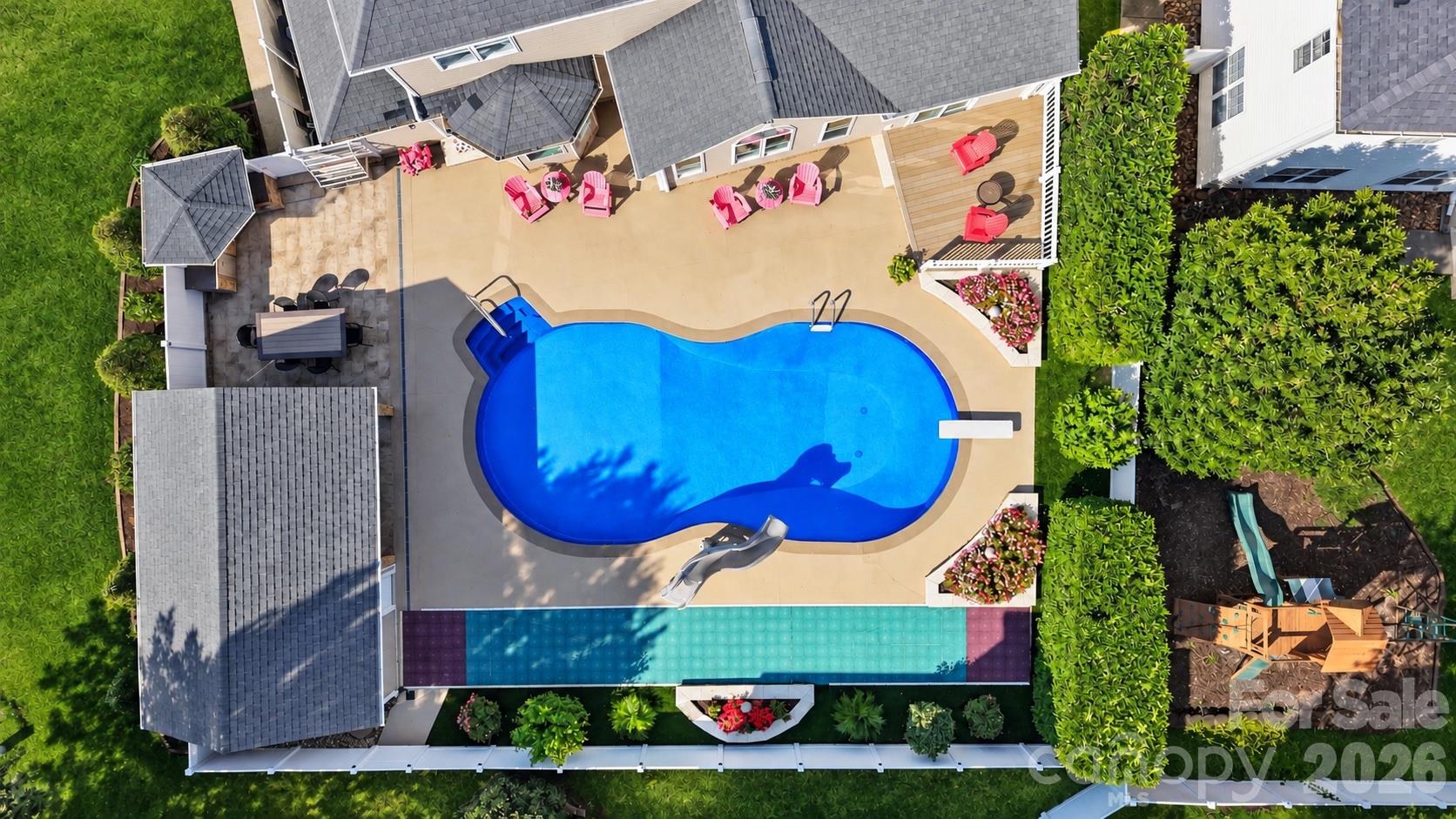 The backyard entertaining area is the showpiece of this home! - 120 Harris Farm Road, Mooresville