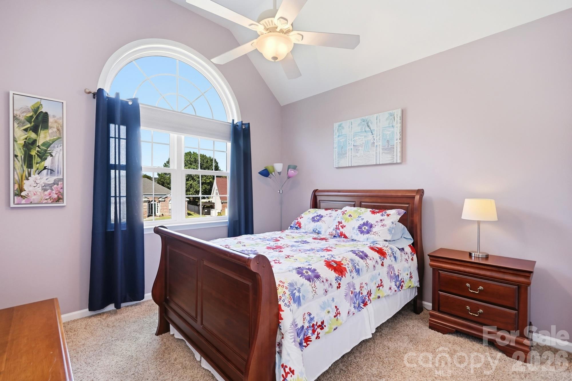 Secondary bedroom on the upper floor with vaulted ceiling and tons of natural light! - 120 Harris Farm Road, Mooresville