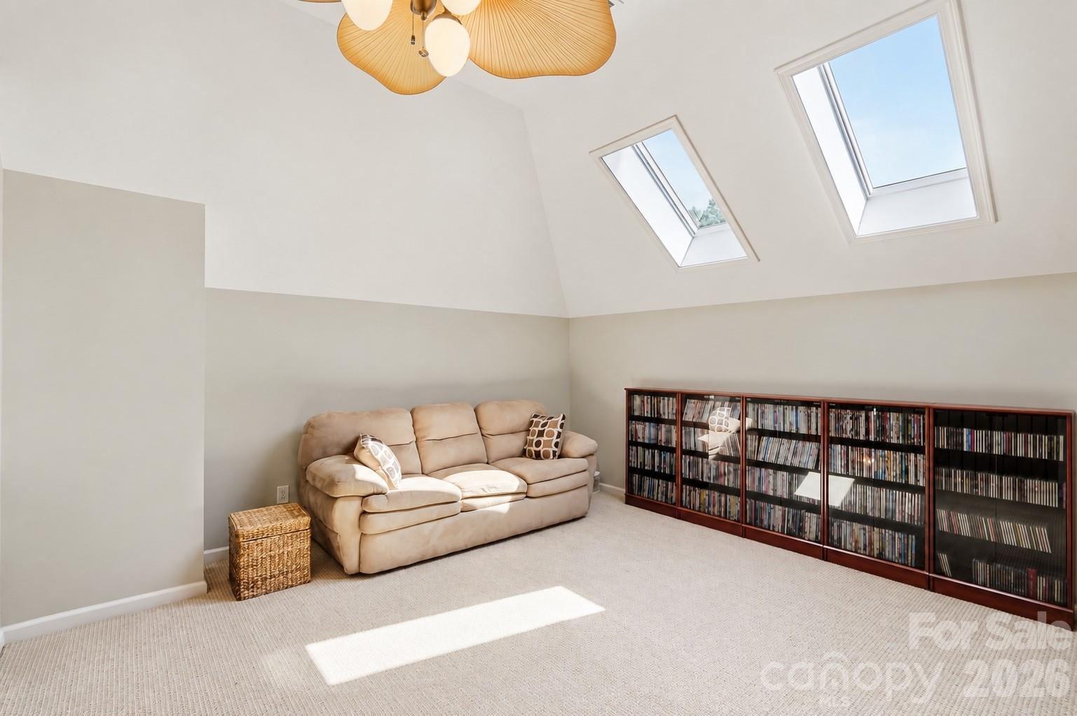 Bright bonus area located a half flight of stairs above the upper level. Plenty of room for many uses and open into the two story foyer. - 120 Harris Farm Road, Mooresville