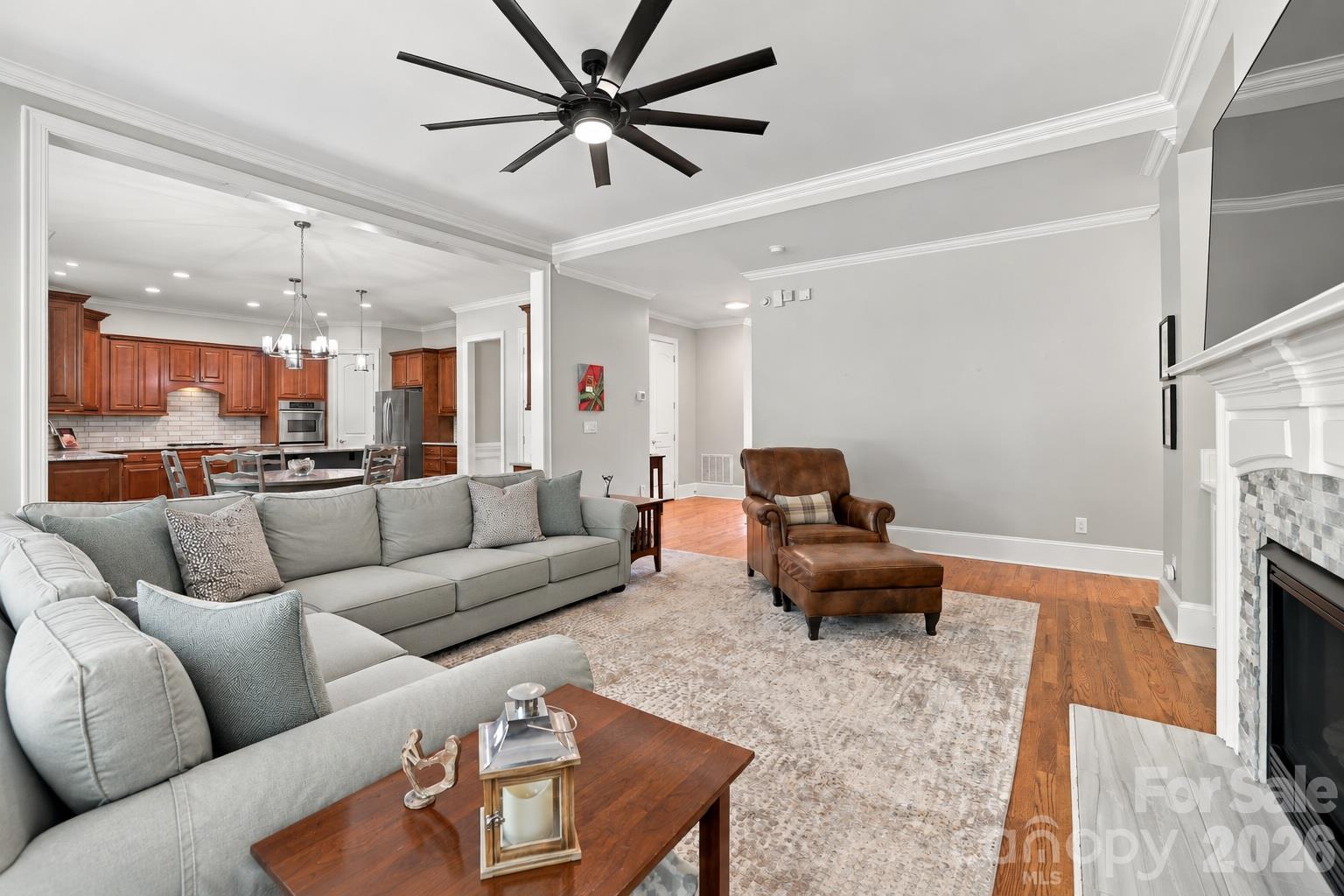 Designed for the way people really live, this spacious great room is just steps from the kitchen and casual dining area, making it easy to move from dinner to movie night or accommodate a houseful of family and friends. - 2309 Highland Forest Drive, Waxhaw