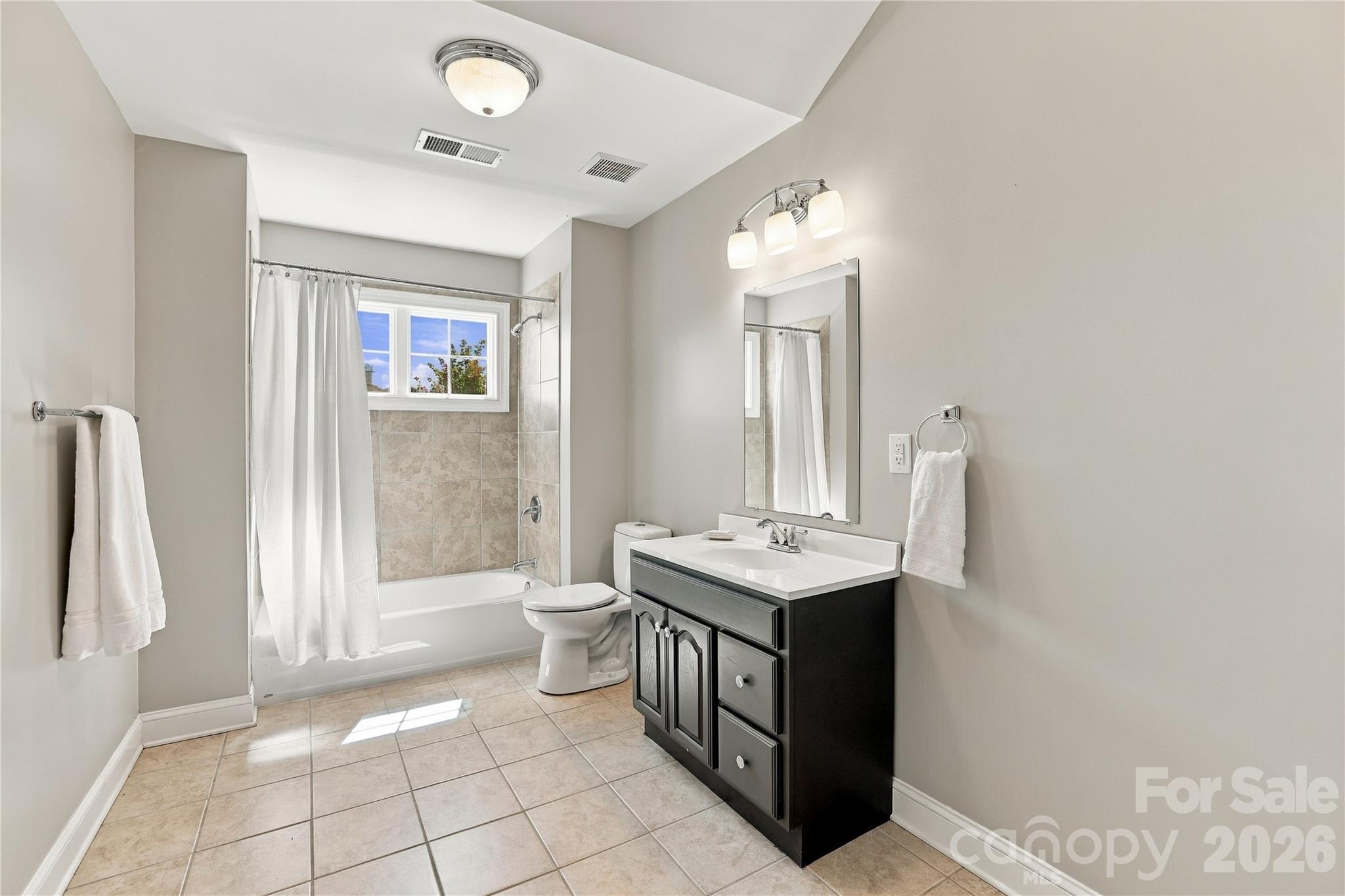 The full bath adds even more flexibility to the finished third floor. Use this level for recreation, a media room or home gym or take advantage of the additional space and full bath to create another bedroom suite, private guest quarters or a combination of living and recreational space. - 2309 Highland Forest Drive, Waxhaw