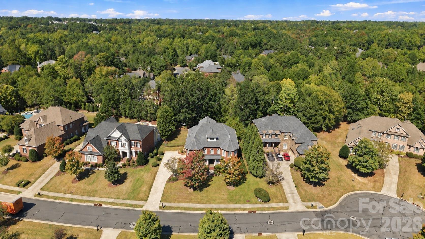 One look from above and you can see why the setting matters. 2309 Highland Forest Drive sits on a cul-de-sac street in Weddington Chase, surrounded by impressive homes and mature trees that stretch across the landscape in every direction. It’s a beautiful setting in one of Union County’s most sought-after communities. - 2309 Highland Forest Drive, Waxhaw